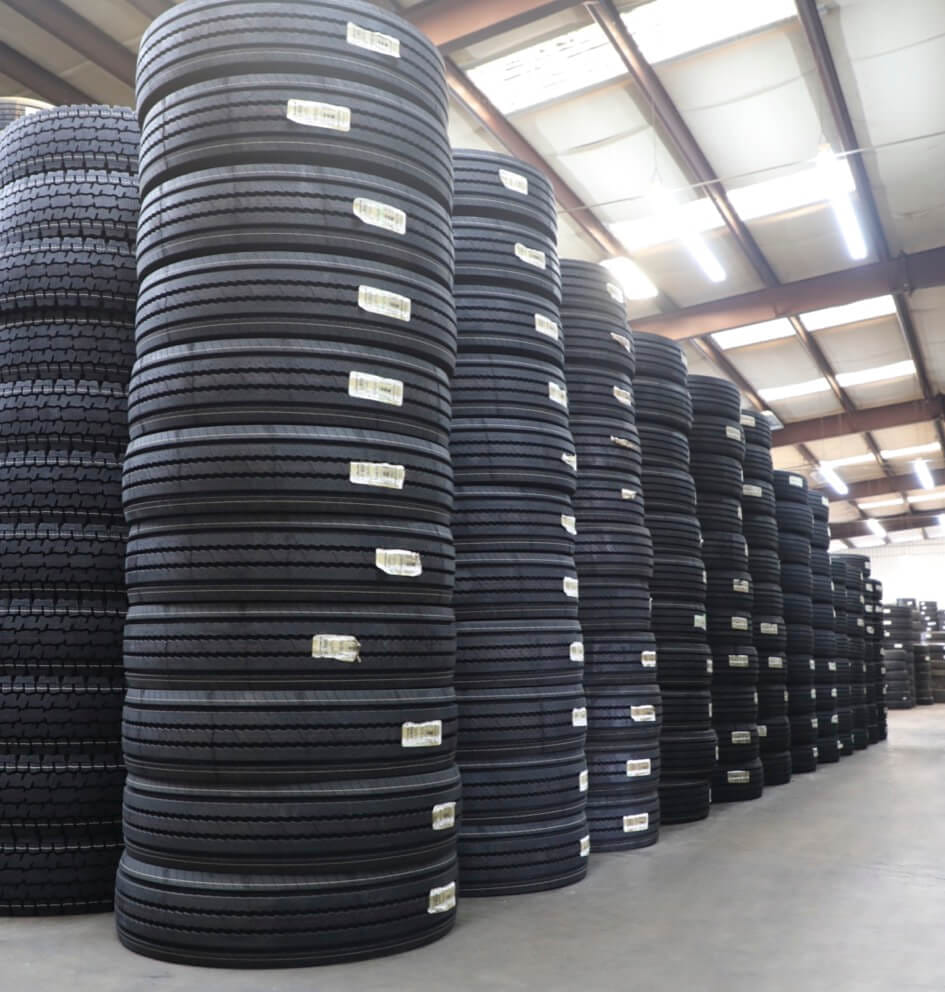 rows of tires piled up in warehouse in Texas