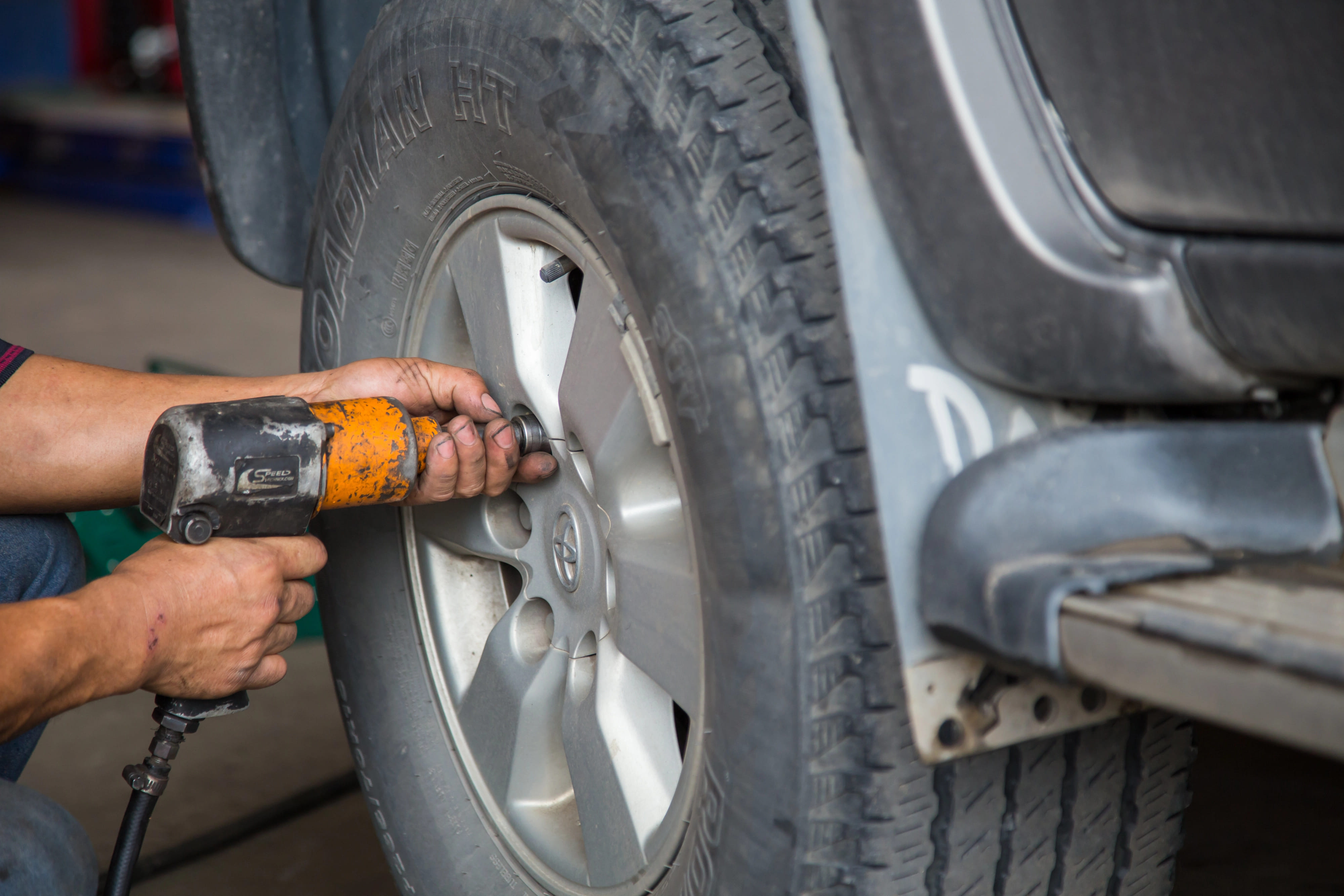 mechanic installing press on tire to industrial vehicle in Central Texas