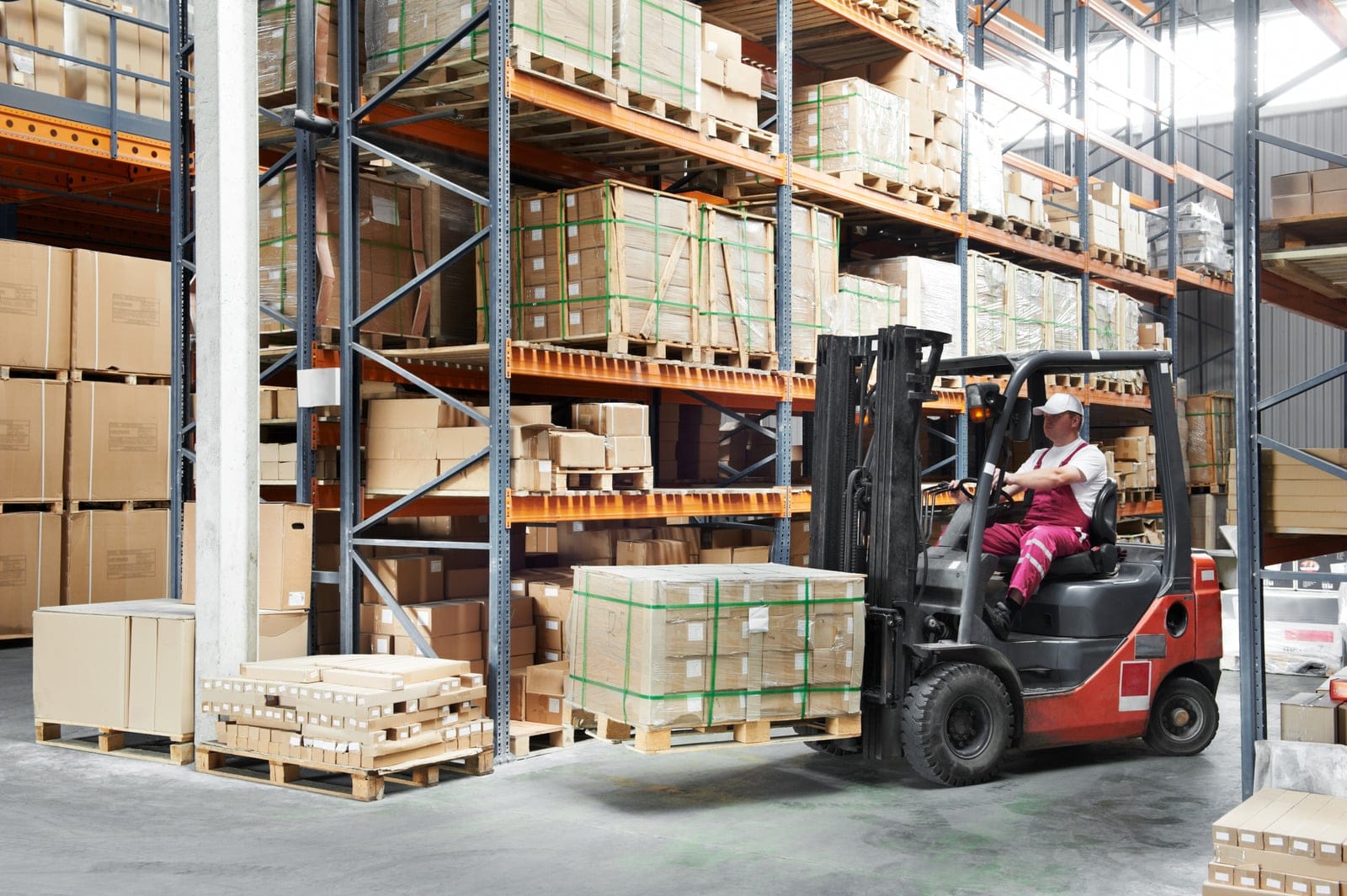 forklift driver moving boxes within a warehouse in Dallas, TX