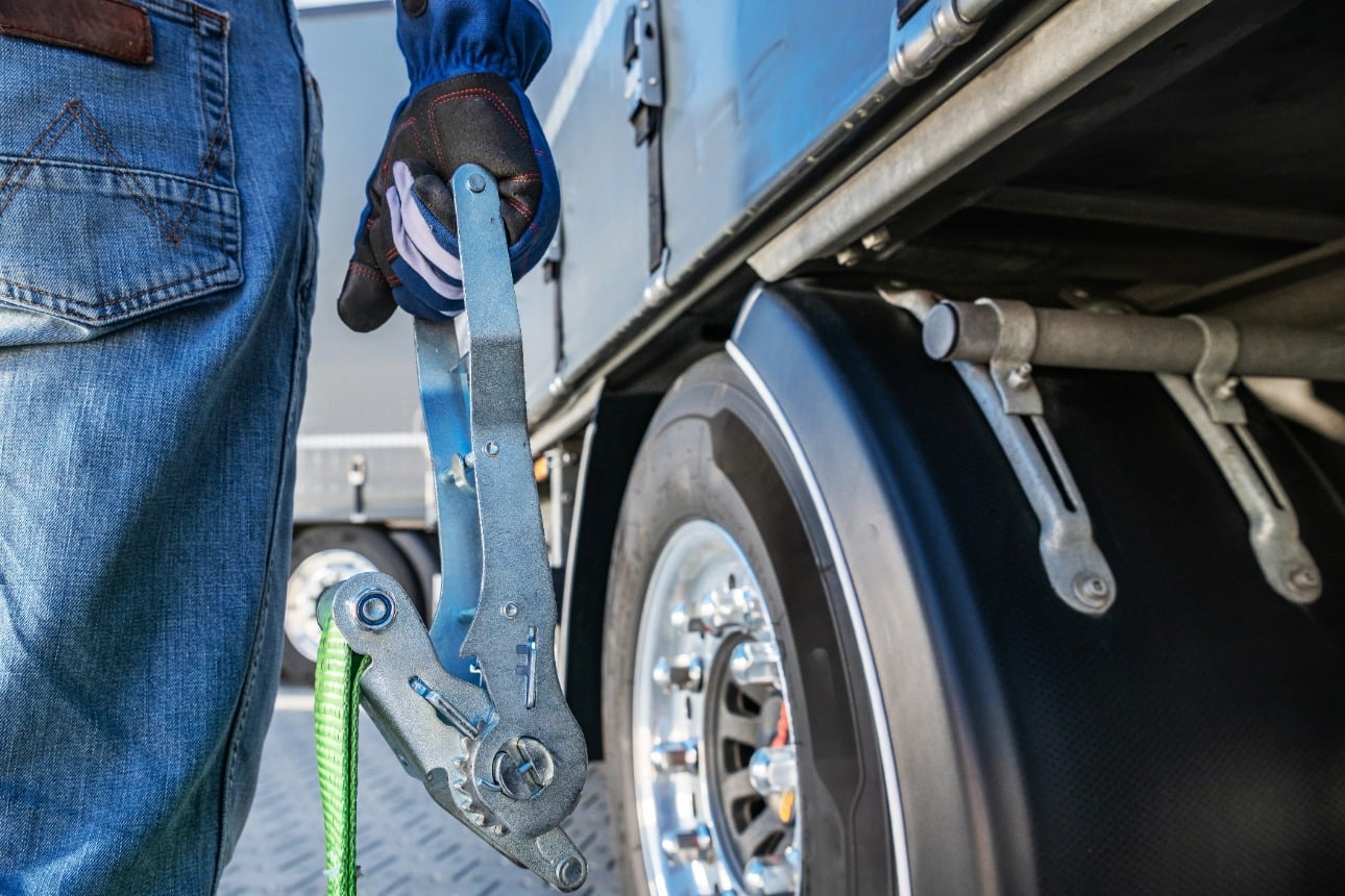 Trucker preparing a heavy-duty semi-truck for delivery