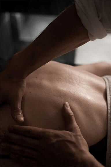 Man massaging shoulder