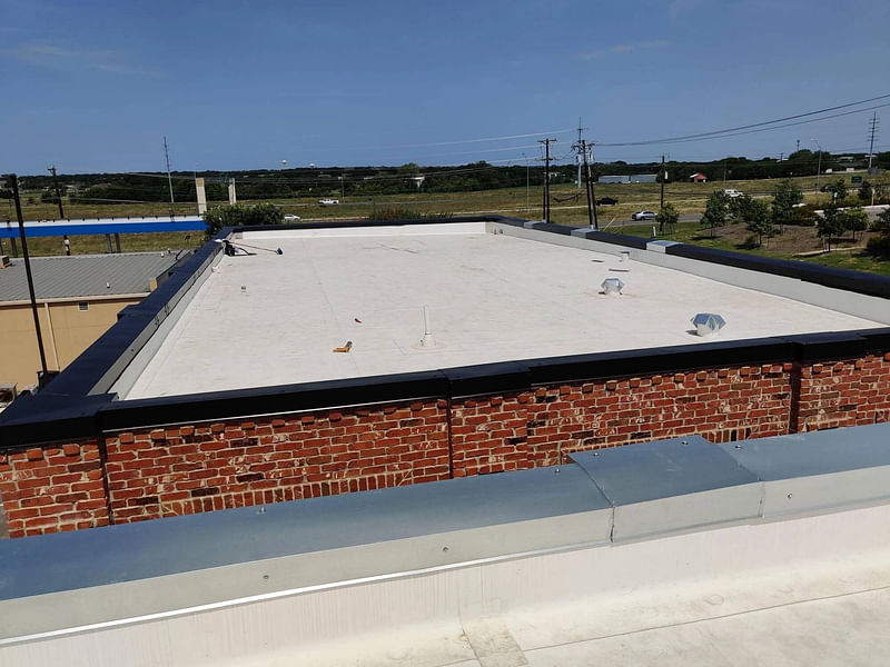 Retail building with whitw coating commercial roof