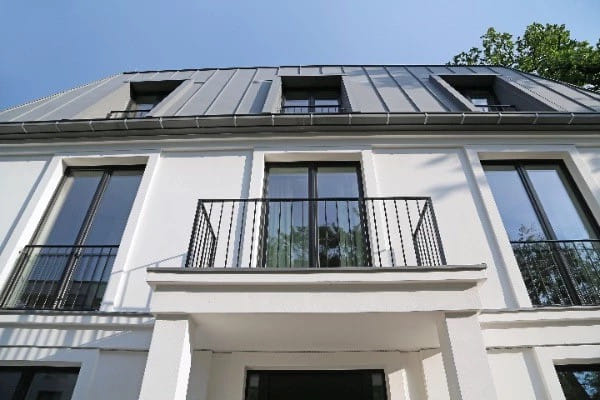 Modern house with metal roof and large windows