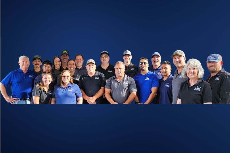 APEX Roofing Staff standing in front of office building