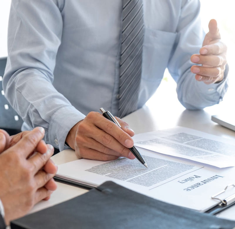 insurance agent explaining insurance policy to the customer