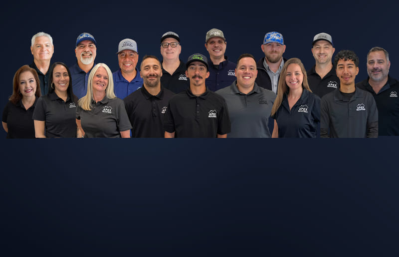 APEX Roofing Staff standing in front of office building