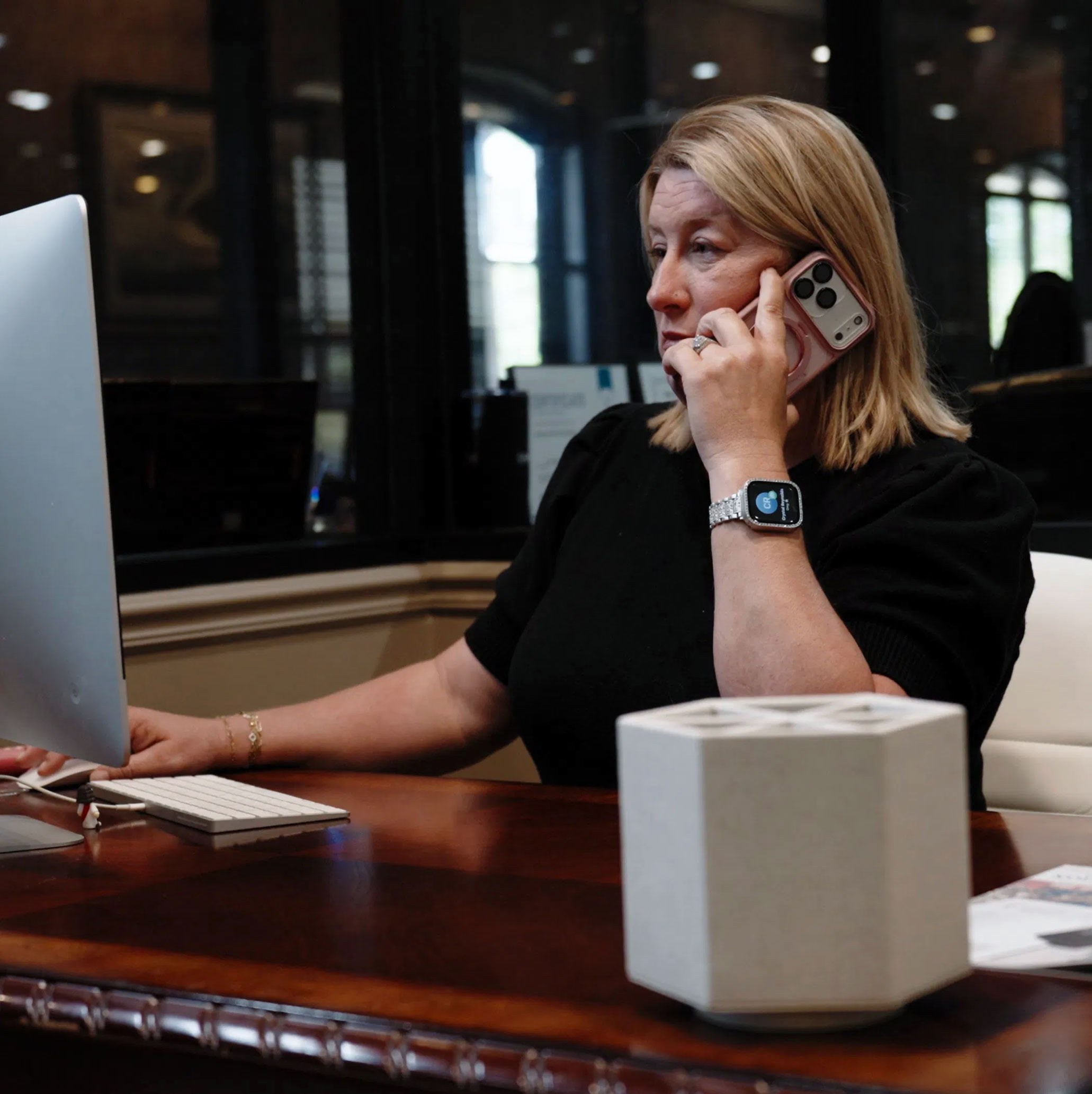 EXIT Real Estate Agent at Work EXIT Real Estate Consultants agent on a phone call at her desk in DeRidder, Louisiana