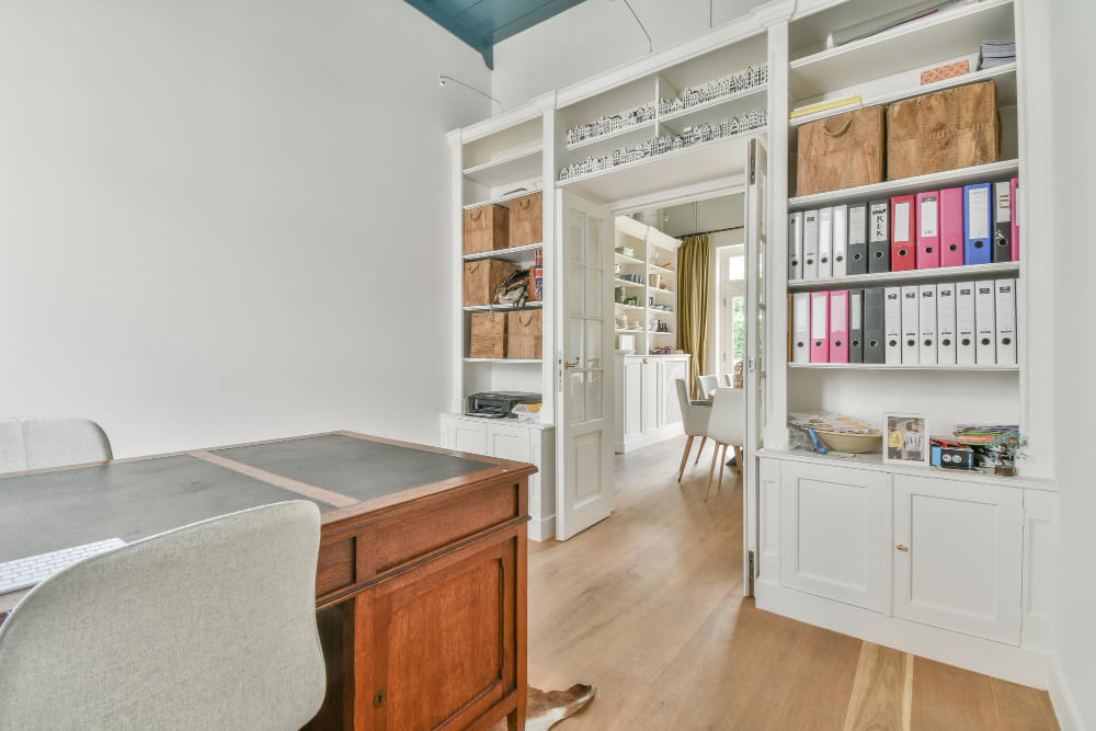 Custom home office cabinets with built-in shelving and file storage designed by The Stone Gallery