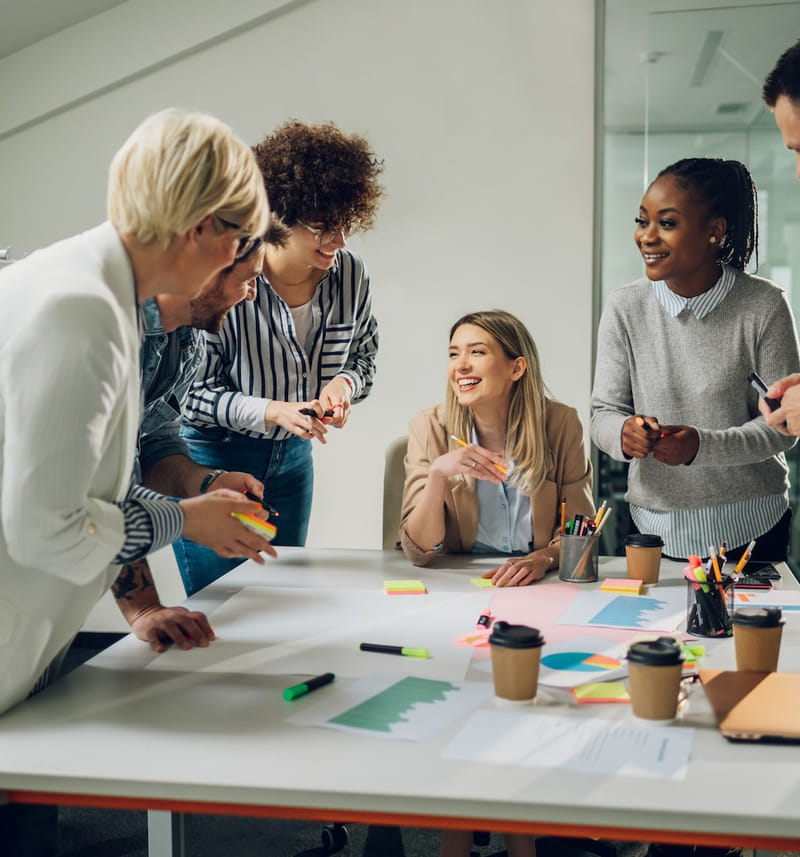 Business professional relaxing with laptop after reviewing construction financial reports Business professional relaxing with laptop after reviewing construction financial reports