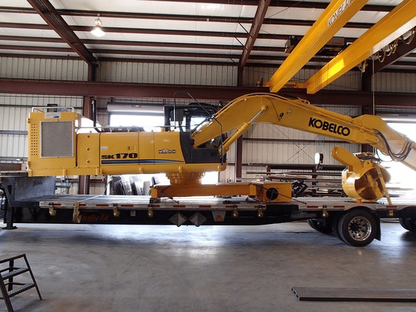 Kobelco excavator sitting in a warehouse