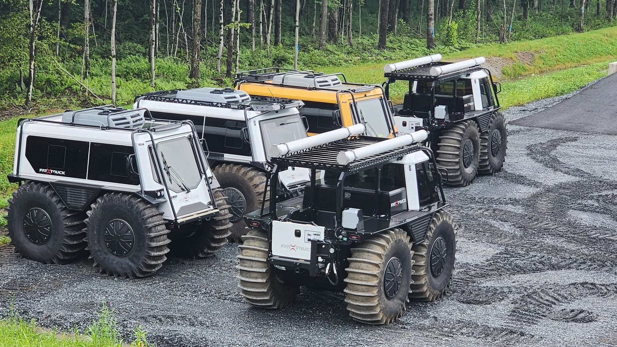 FT5 fat trucks sitting near wooded areas