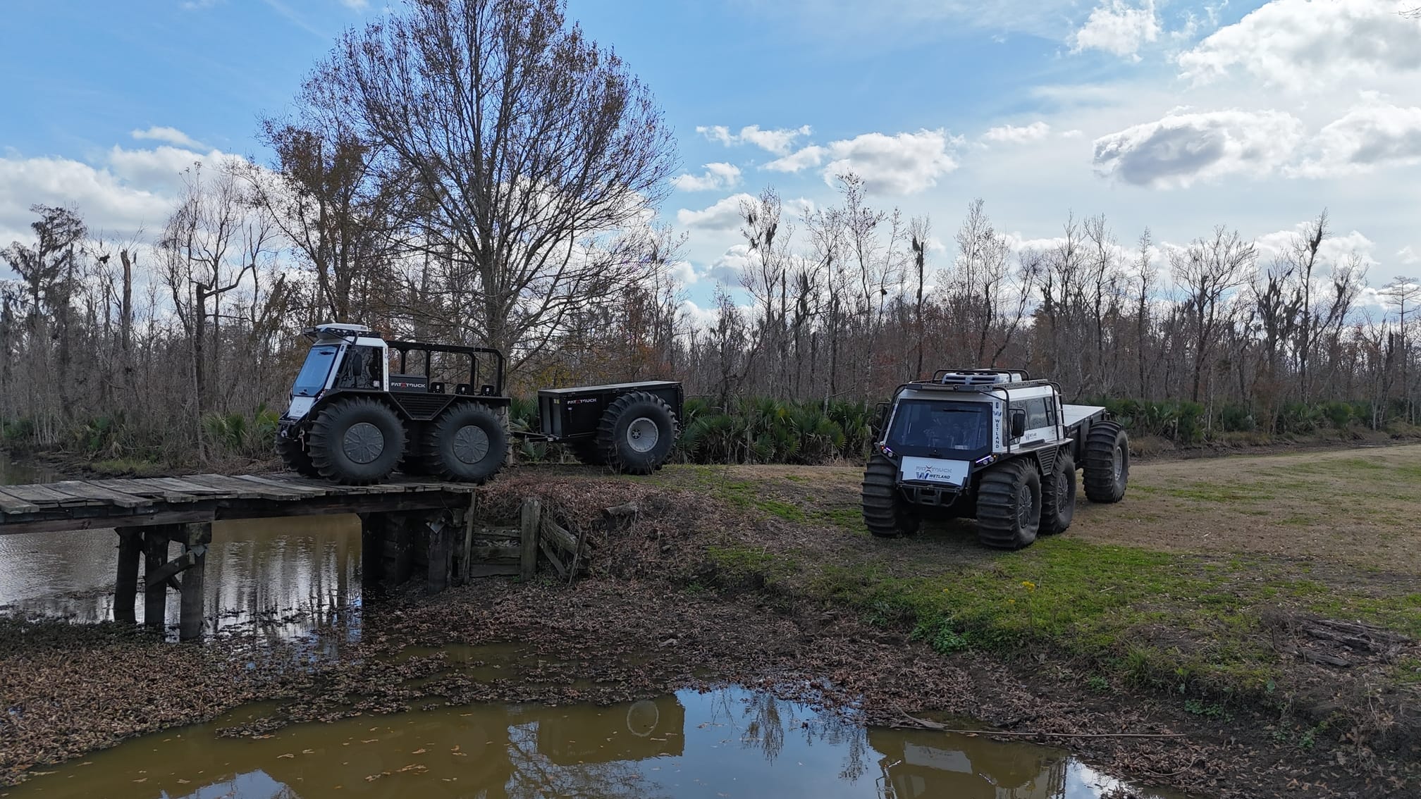 FT3 parked on grassy terrain near river