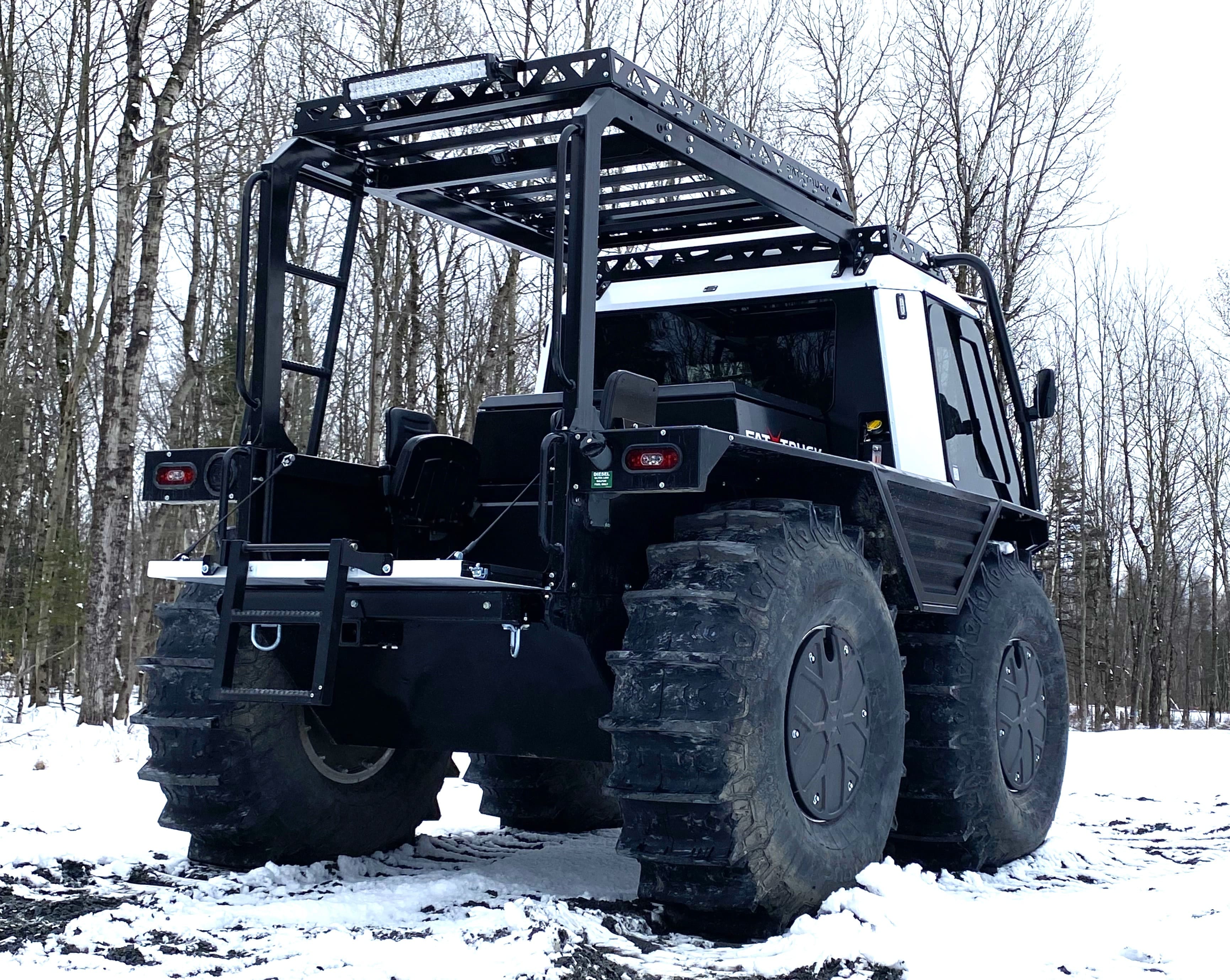 White FT3 Pickup driving on snowy, frozen terrain
