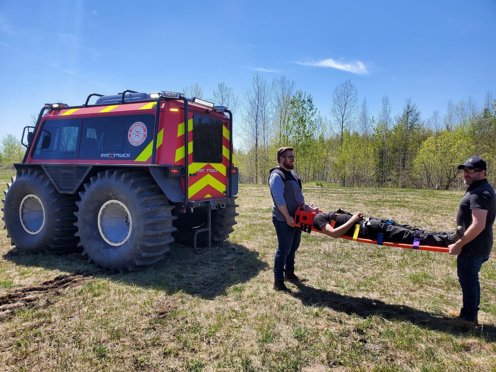 Rescue trainer standing next to Fat Truck as he conducts a field training operation