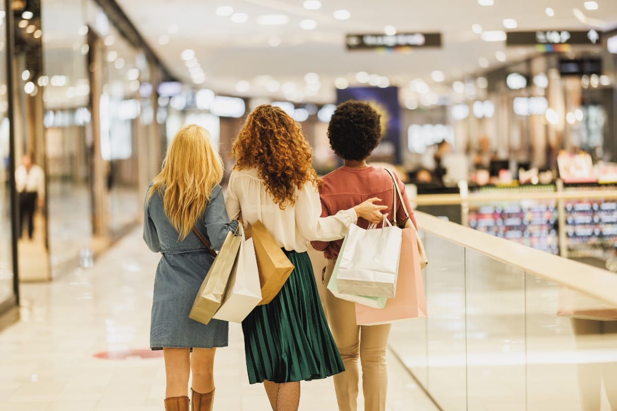 young woman walking in a shopping mall
