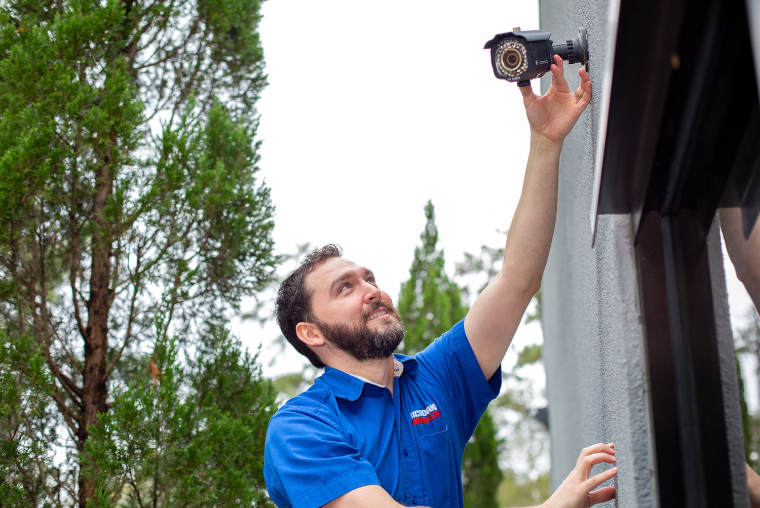 IT Tech working on security camera in Baton Rouge