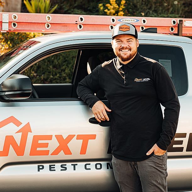 Pest Control professional next to truck