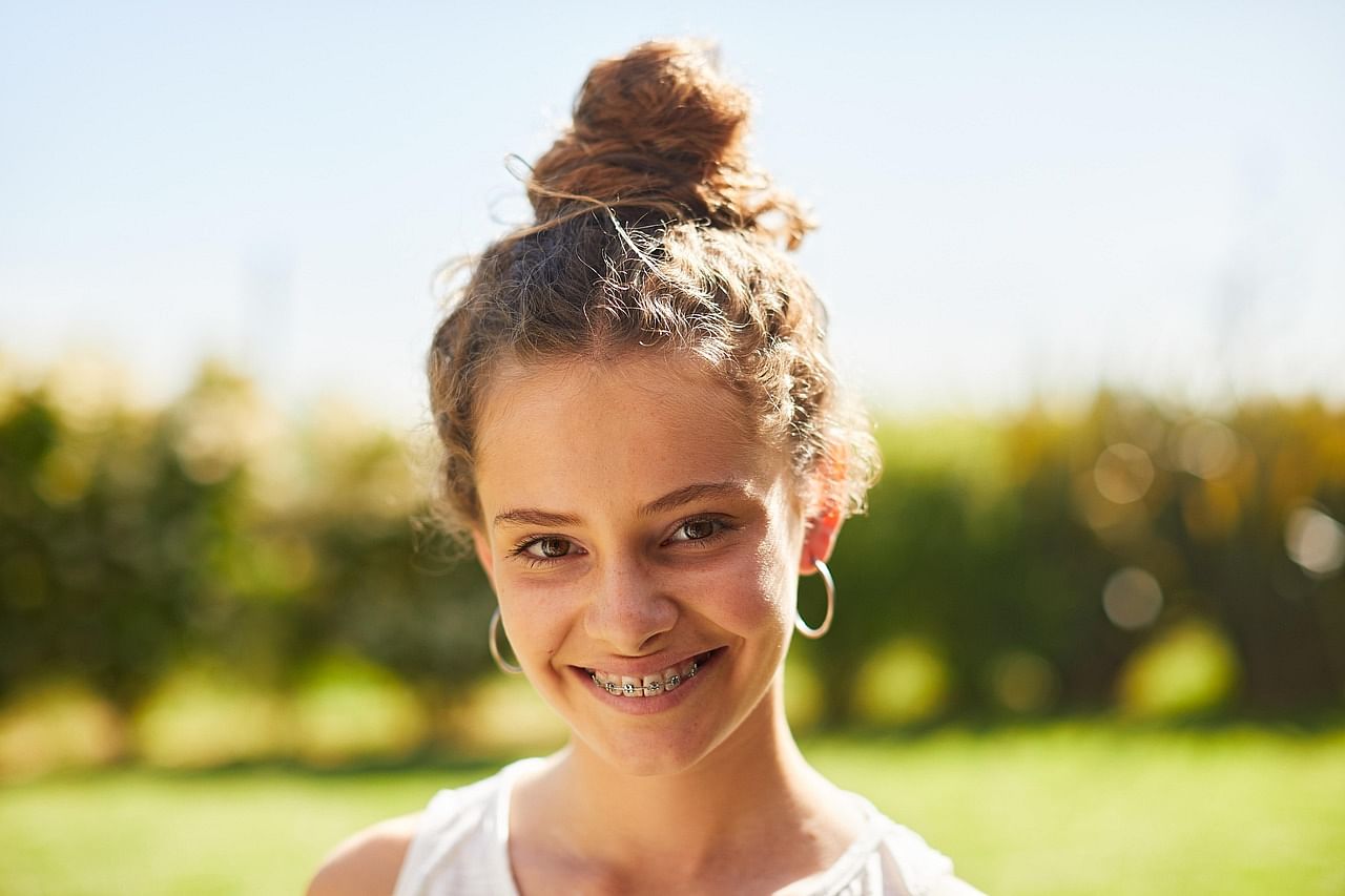Young Girl smiling with her braces