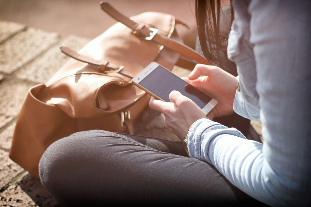 woman looking at her phone