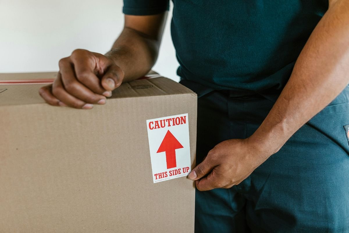 Man keeping hand on box