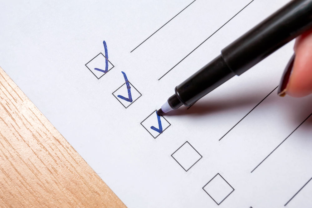 pen checking a checklist