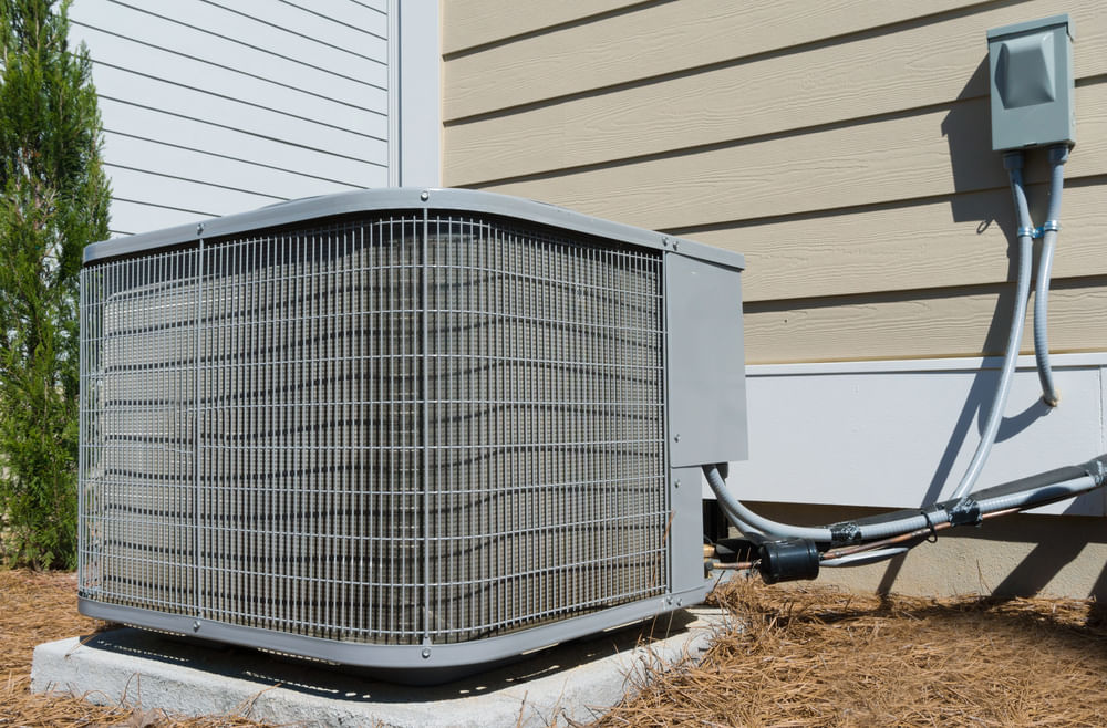 ac unit outside white and taupe