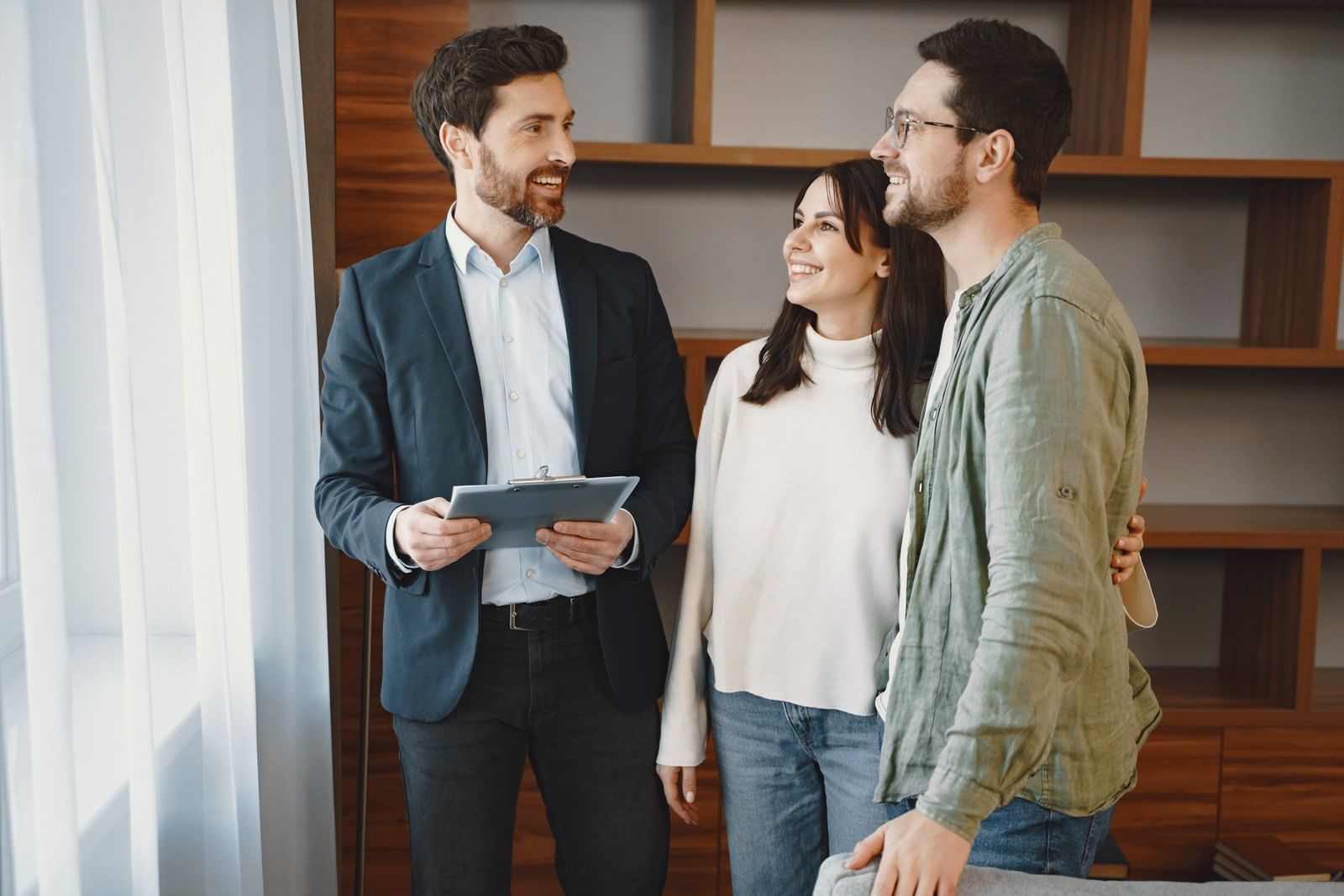 couple talking to a real estate agent