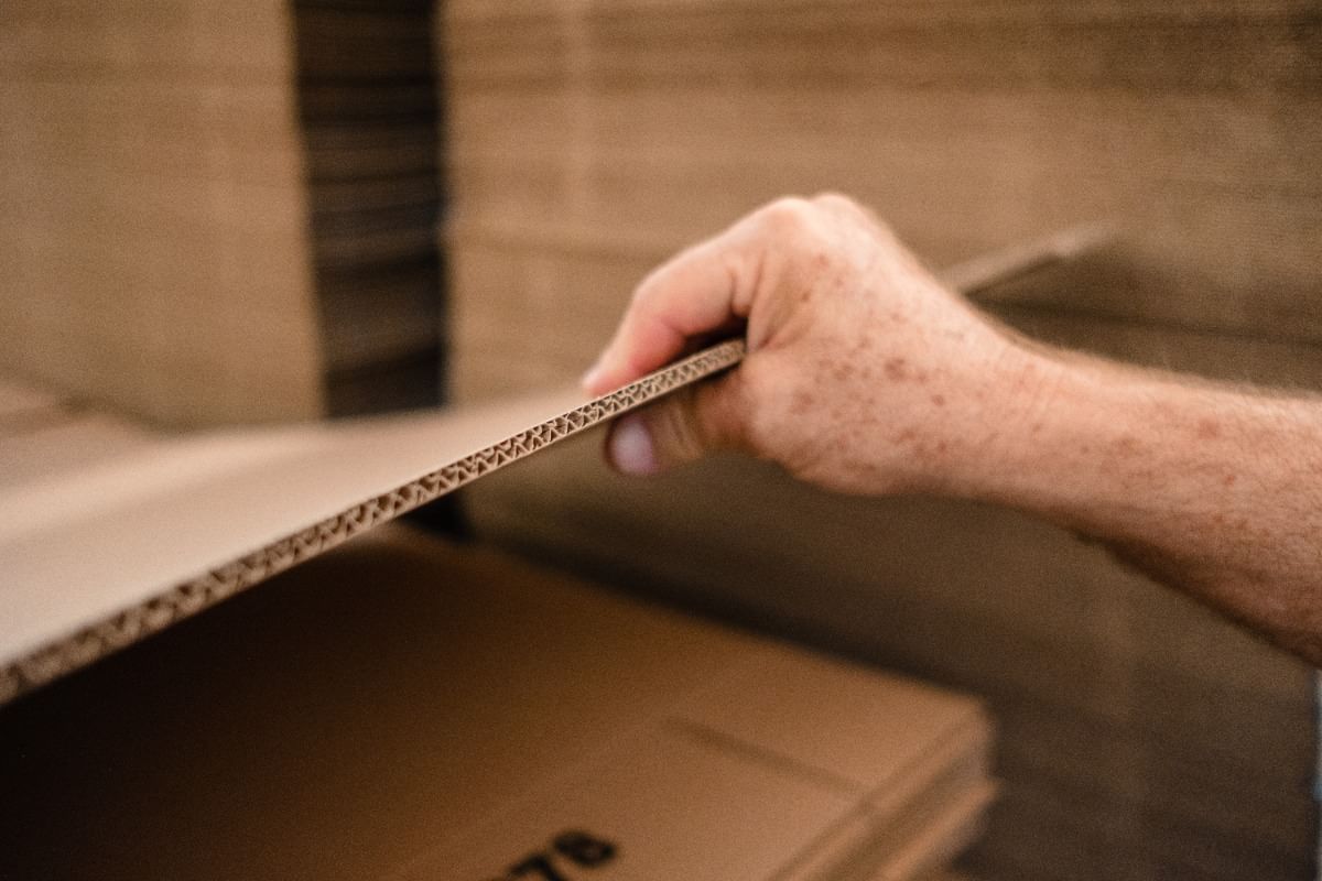 mover picking up cardboard box