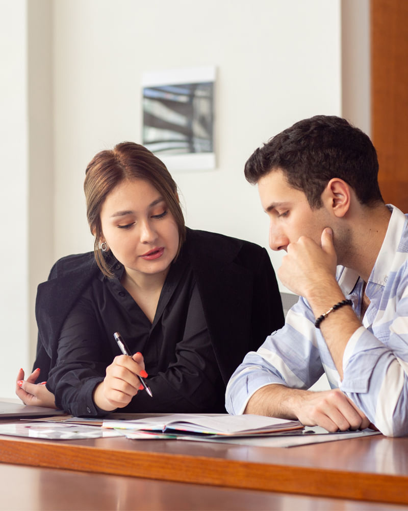 Tax advisor meeting with a client to review financial documents and deductions