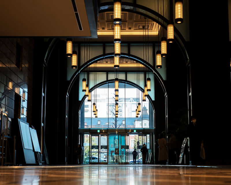 Modern hotel lobby with seating and indoor plants, maintained to high cleanliness standards. Modern hotel lobby with seating and indoor plants, maintained to high cleanliness standards.