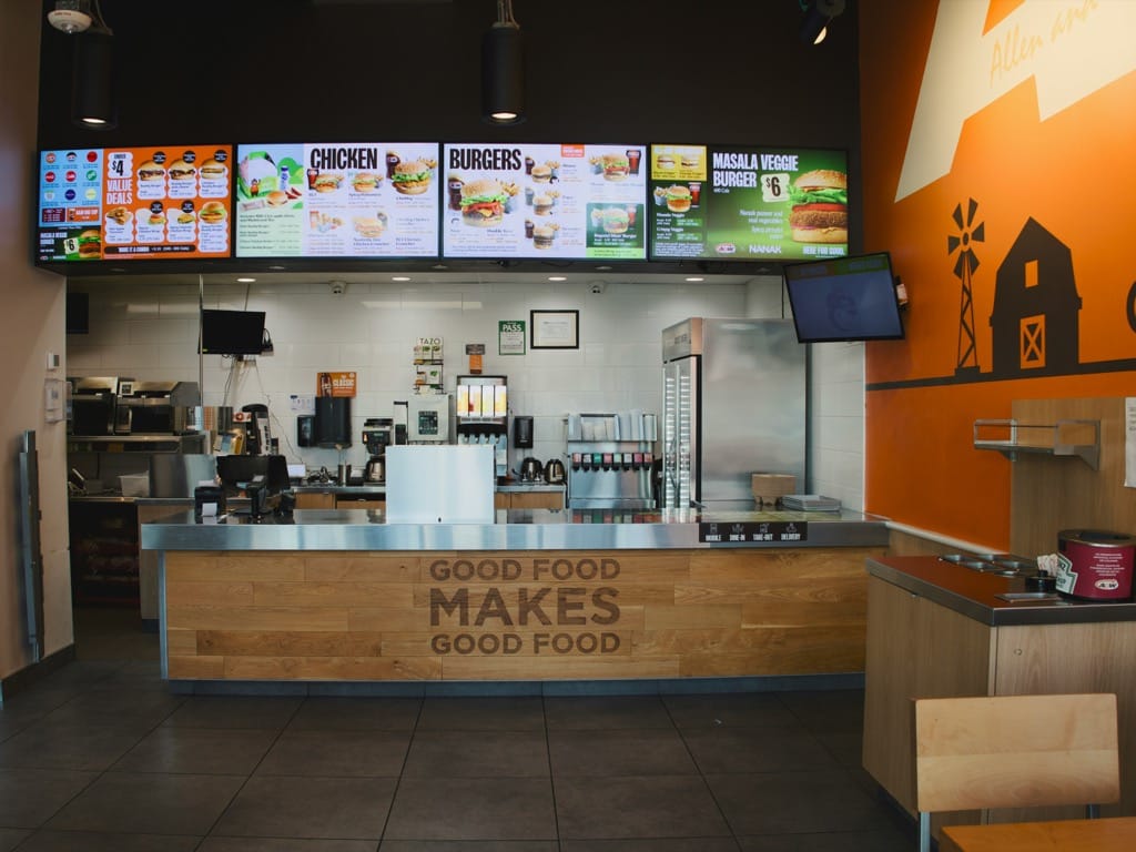 Café interior with menu boards and illuminated lighting