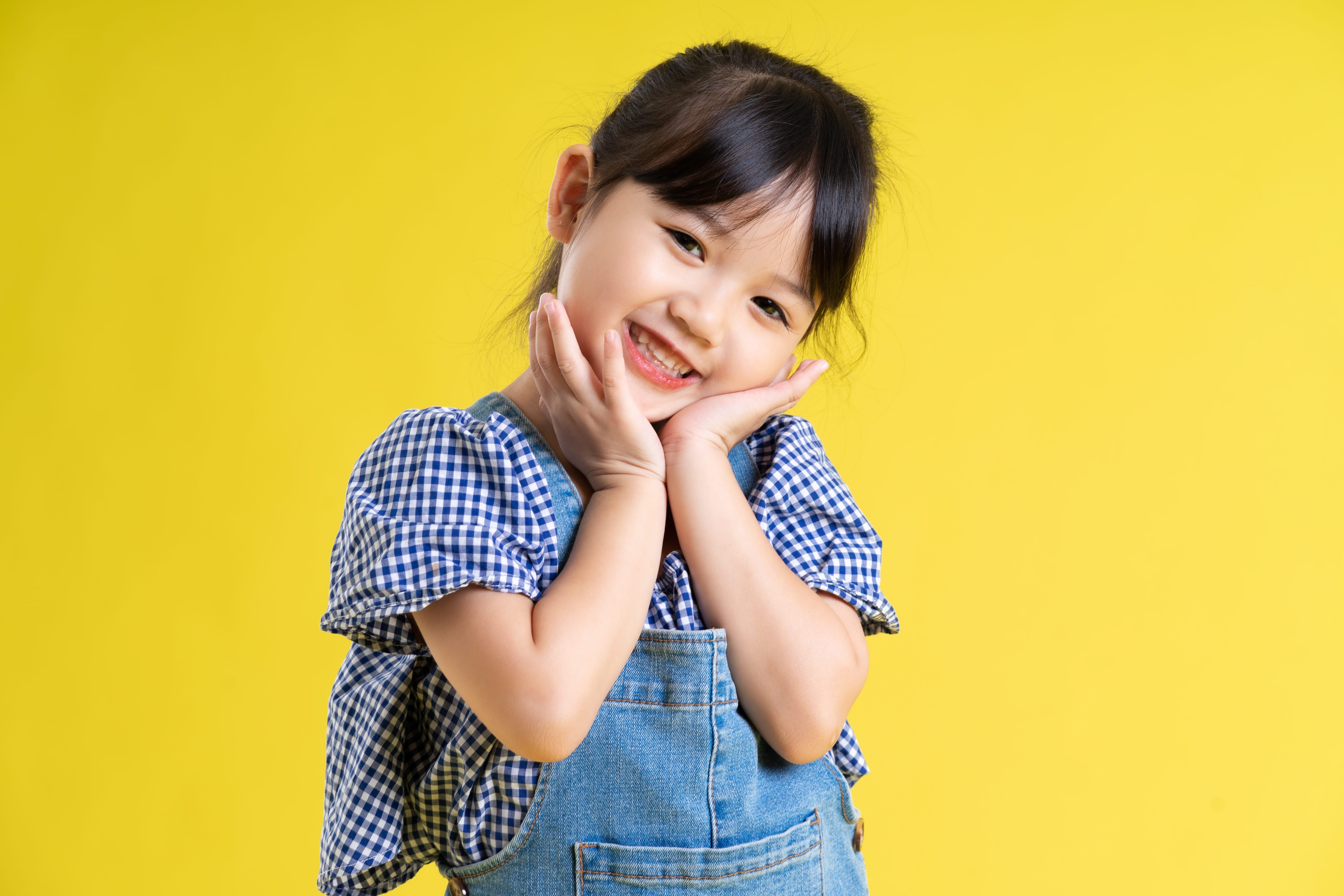 Young girl smiling confidently after early orthodontic care at Frugé Orthodontics in Louisiana. Young girl smiling confidently after early orthodontic care at Frugé Orthodontics in Louisiana.