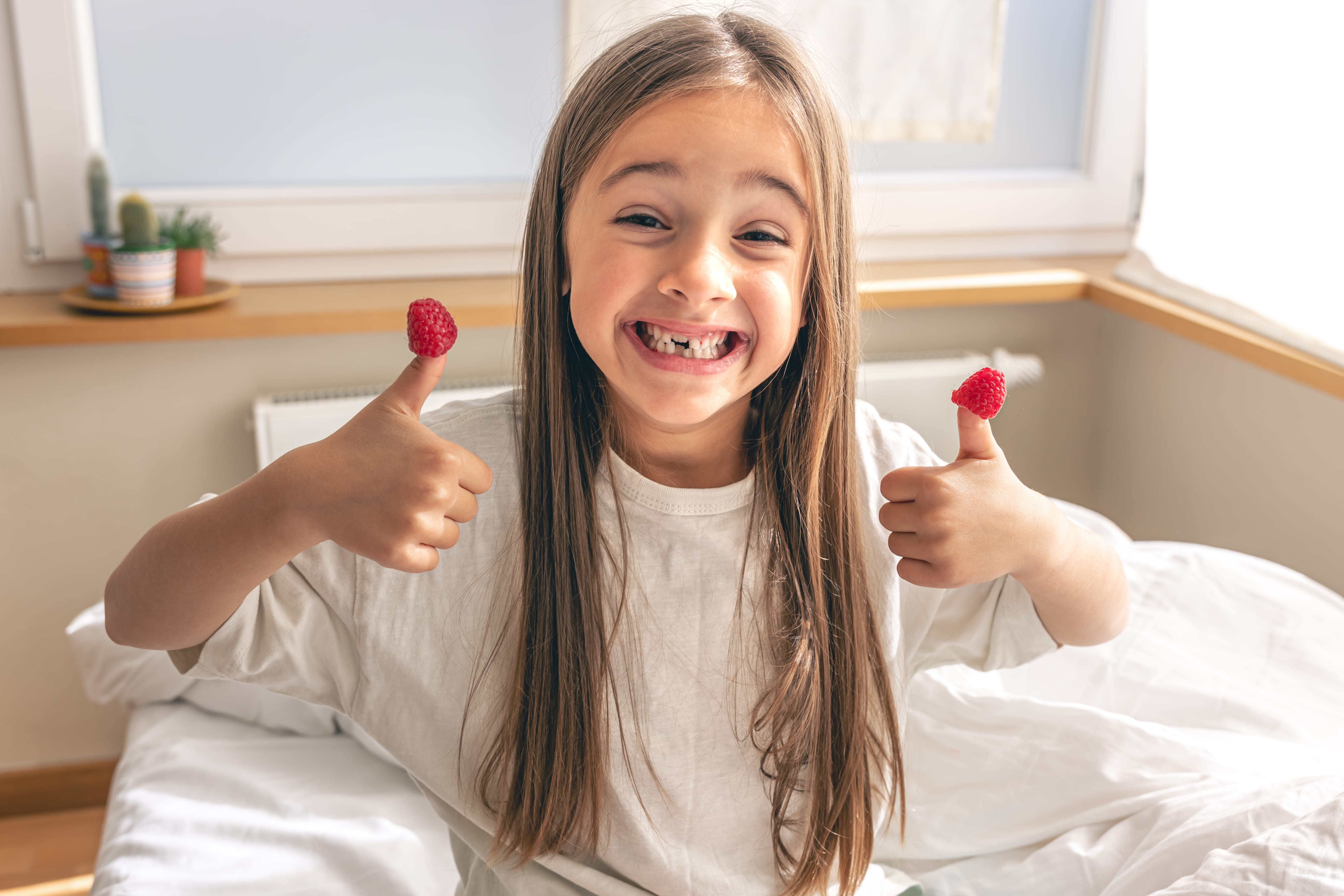 Happy child giving thumbs up after a positive kids orthodontic visit at Frugé Orthodontics in Louisiana. Happy child giving thumbs up after a positive kids orthodontic visit at Frugé Orthodontics in Louisiana.