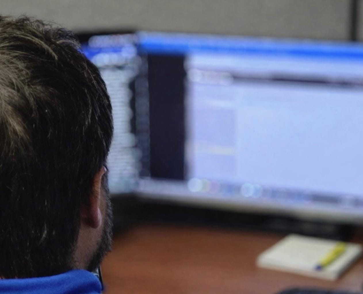 Man speaking to colleague