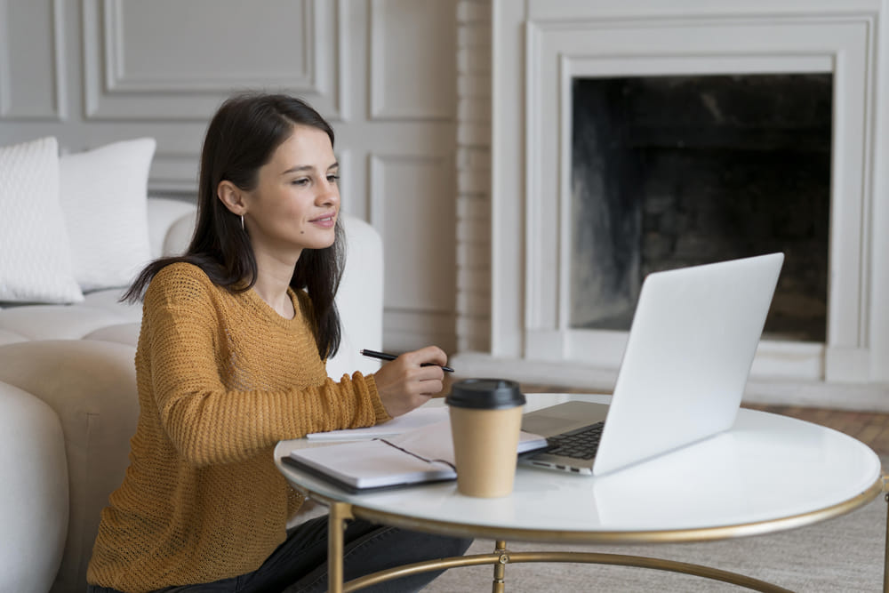 Woman creating moving timeline on laptop while planning international move from San Antonio