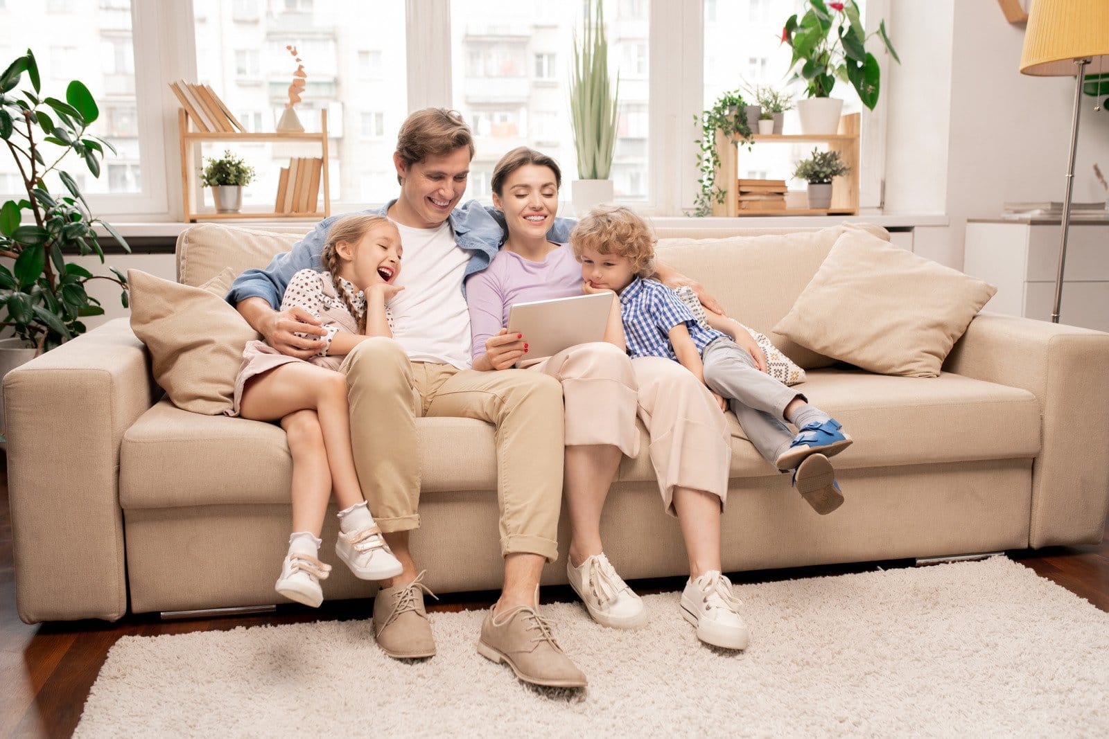 Family relaxing indoors after eco-friendly pest control treatment in Sacramento home