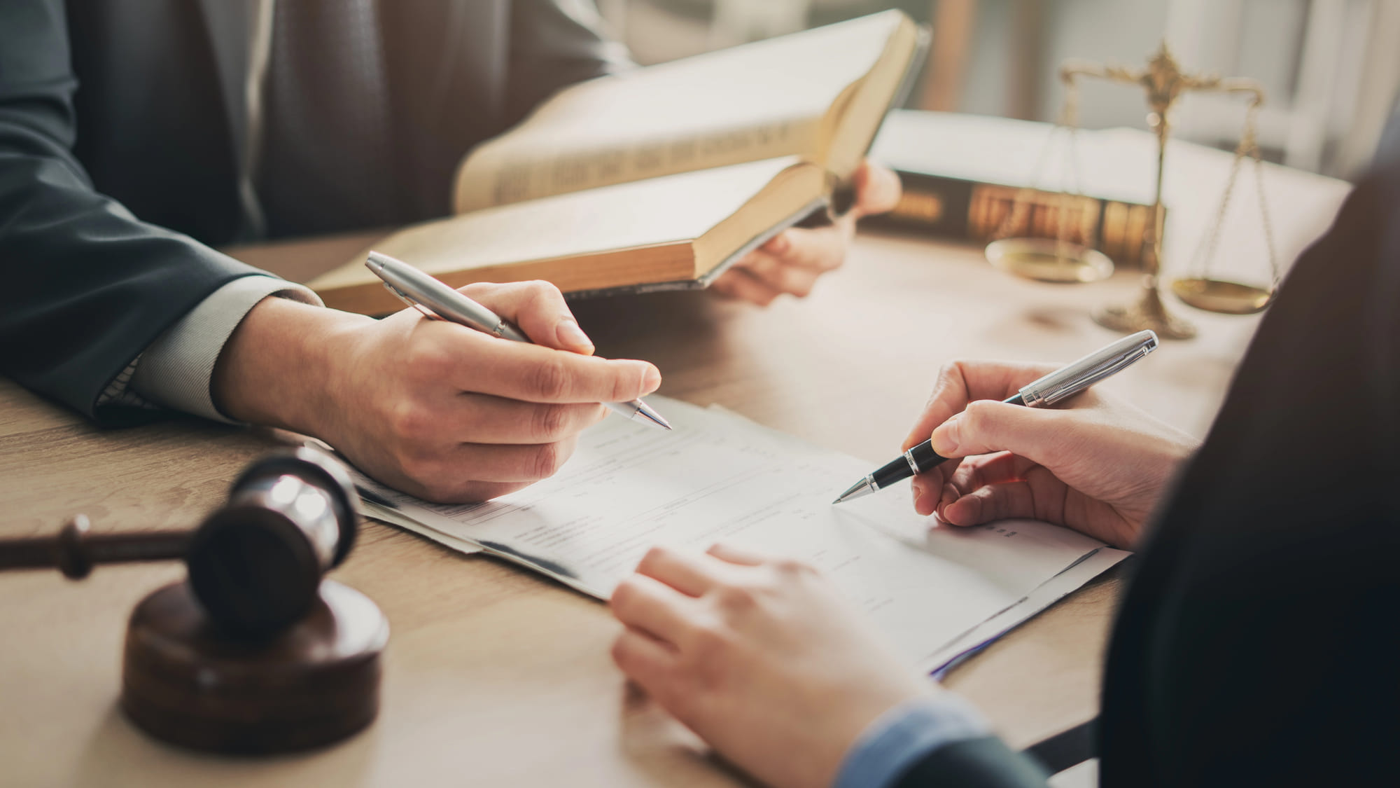Legal discussion and signing document at the table