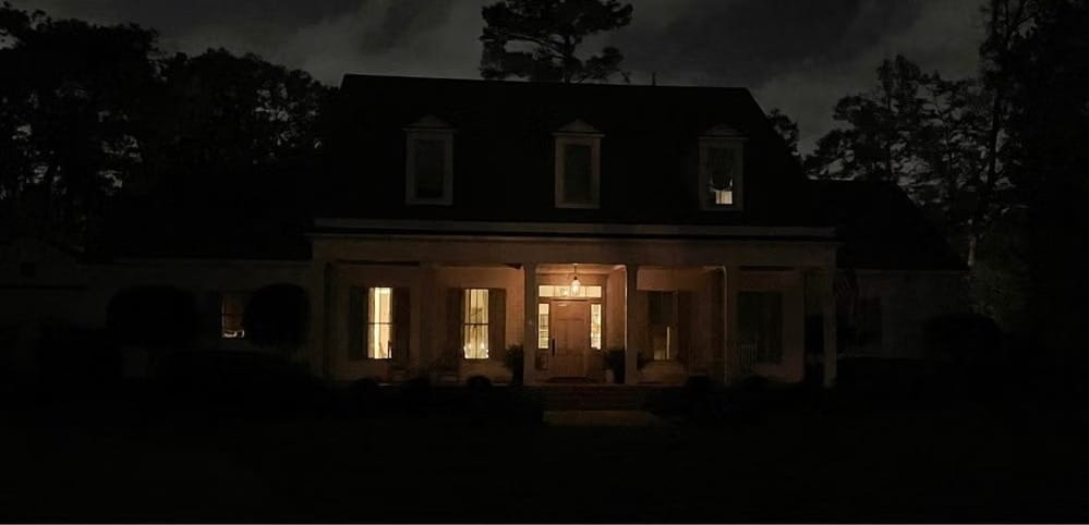 White two-story home in Covington, LA before adding home exterior lighting