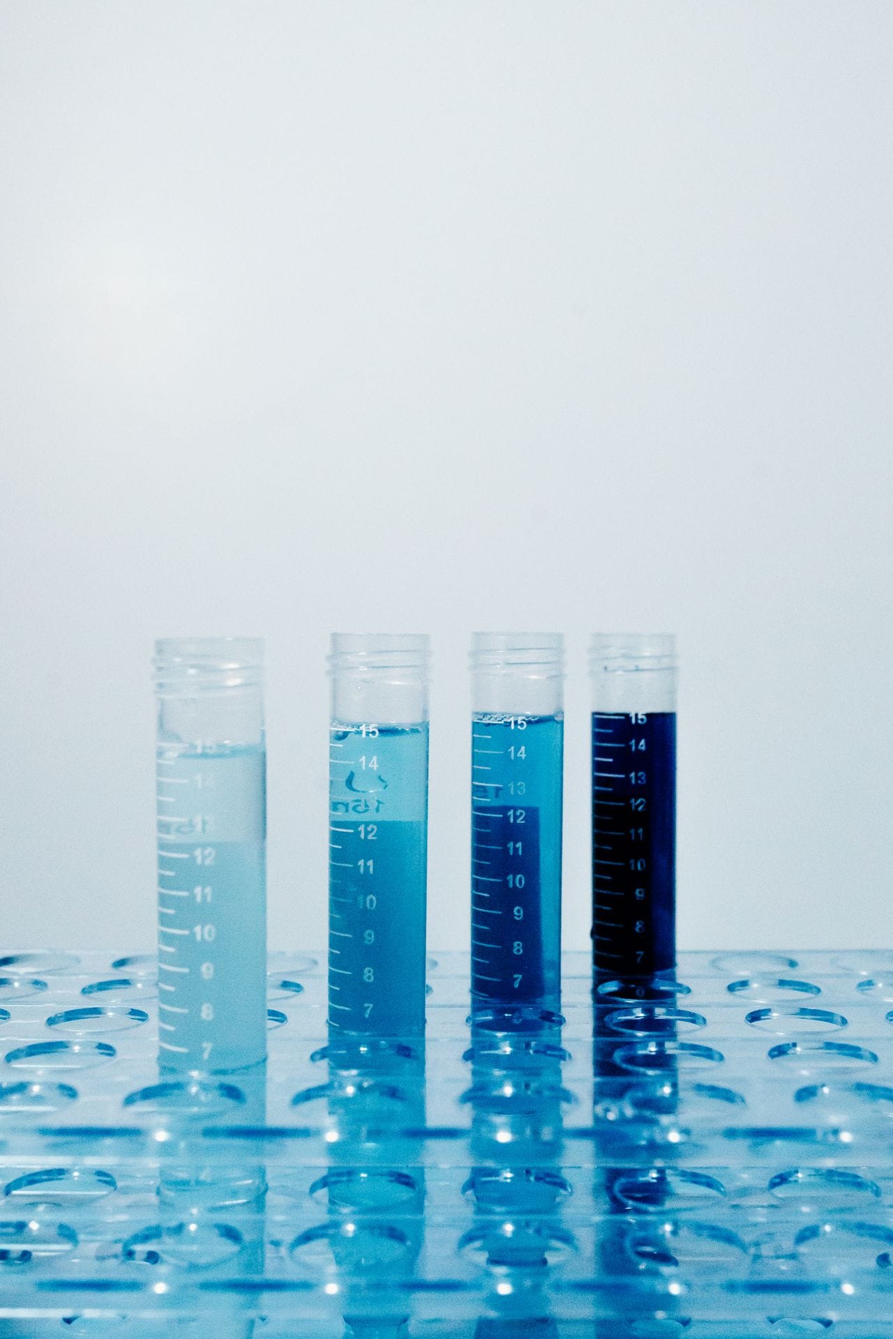 Graduated test tubes showing pool water chlorine color comparison