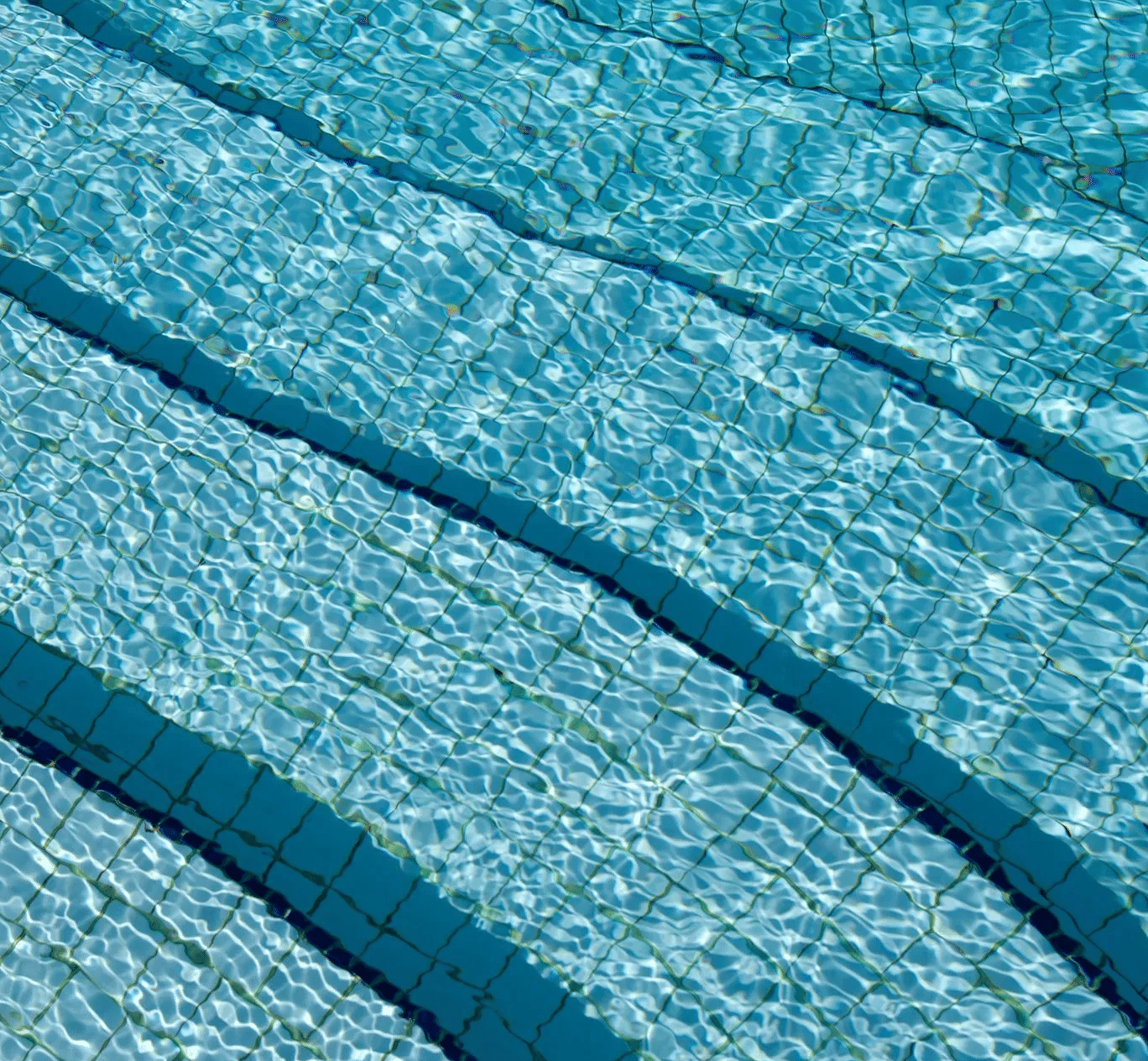 close-up of blue waterin a swimming pool with blue tile