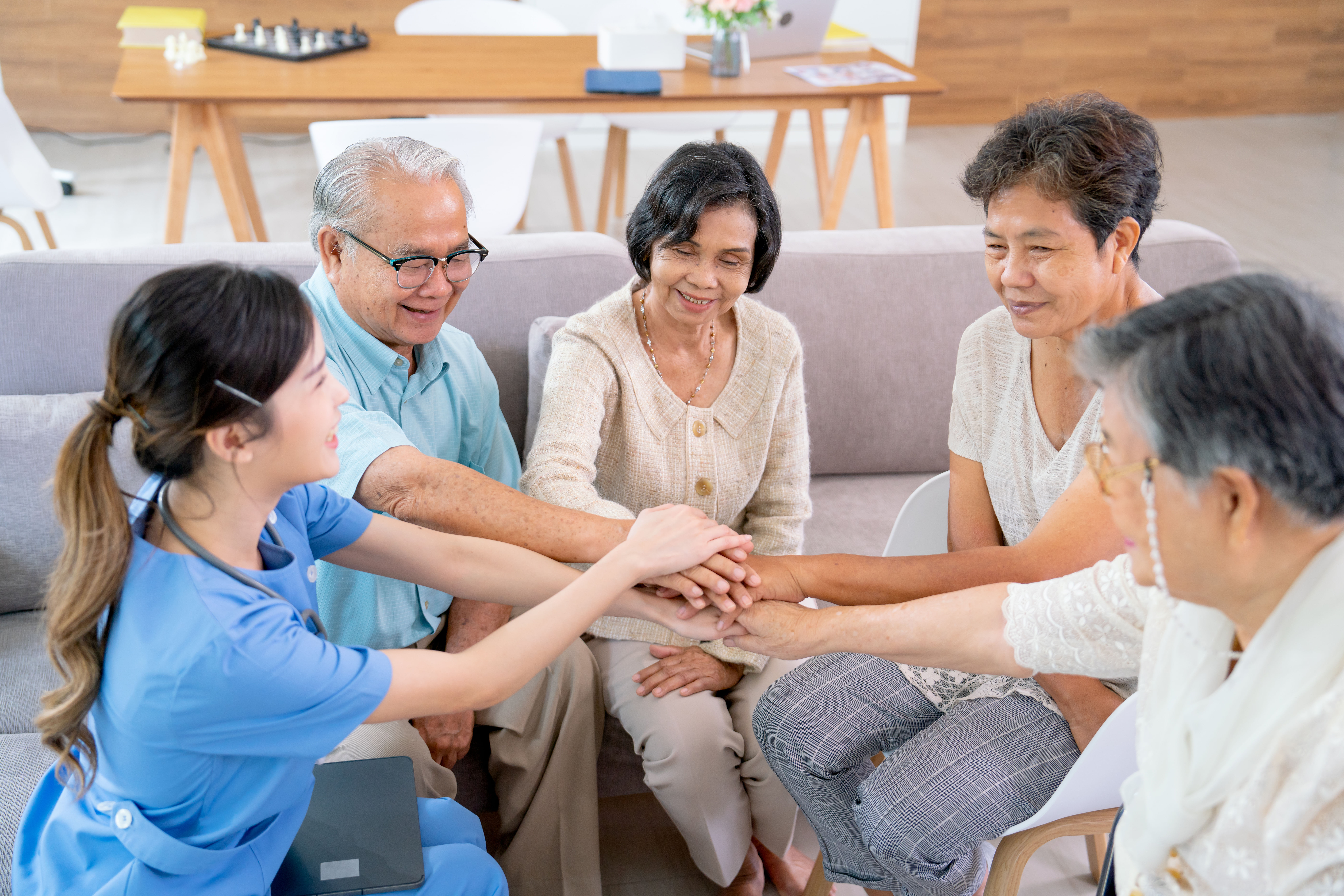 senior man and woman joining hands