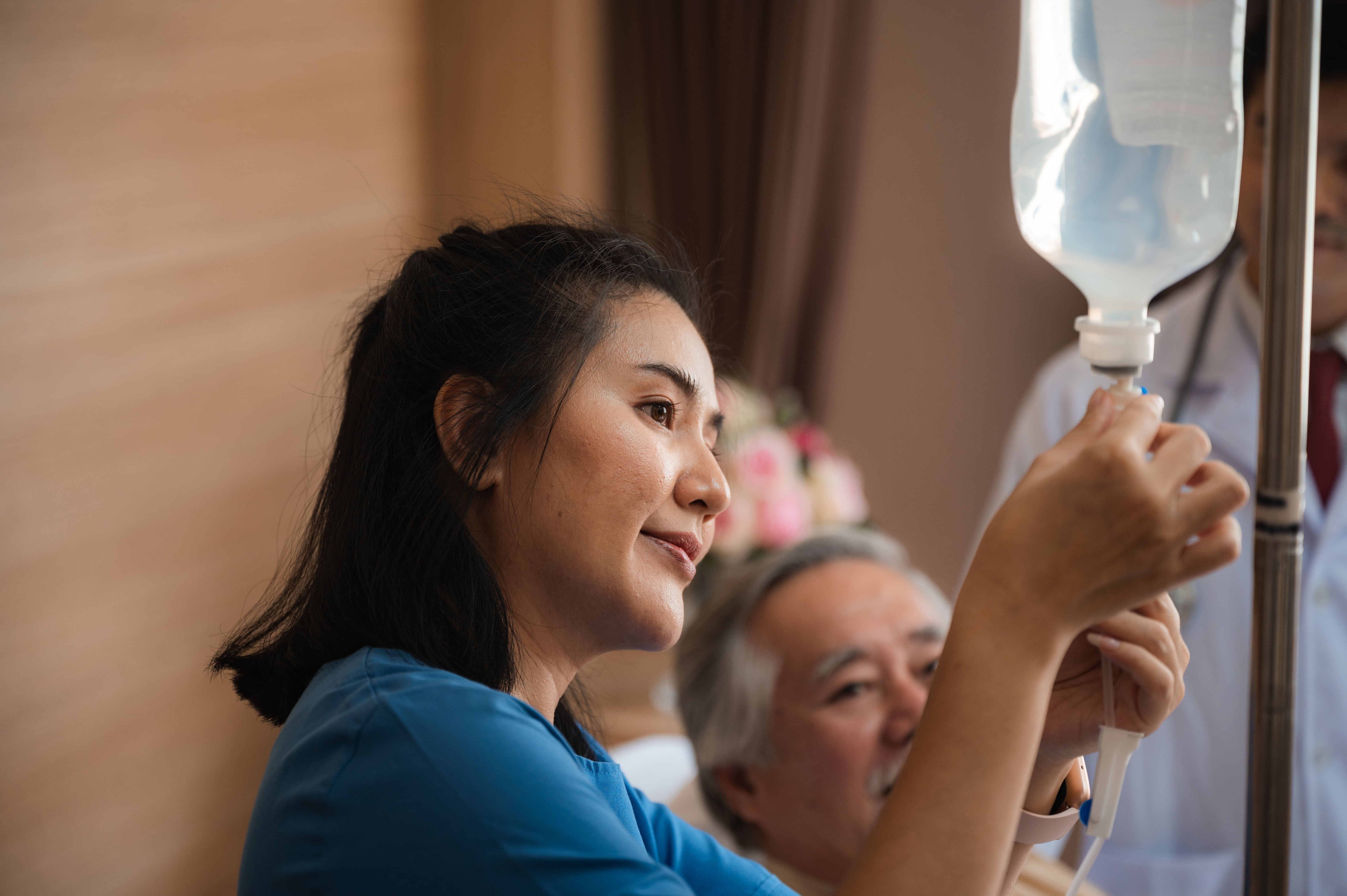nurse fixing saline drip