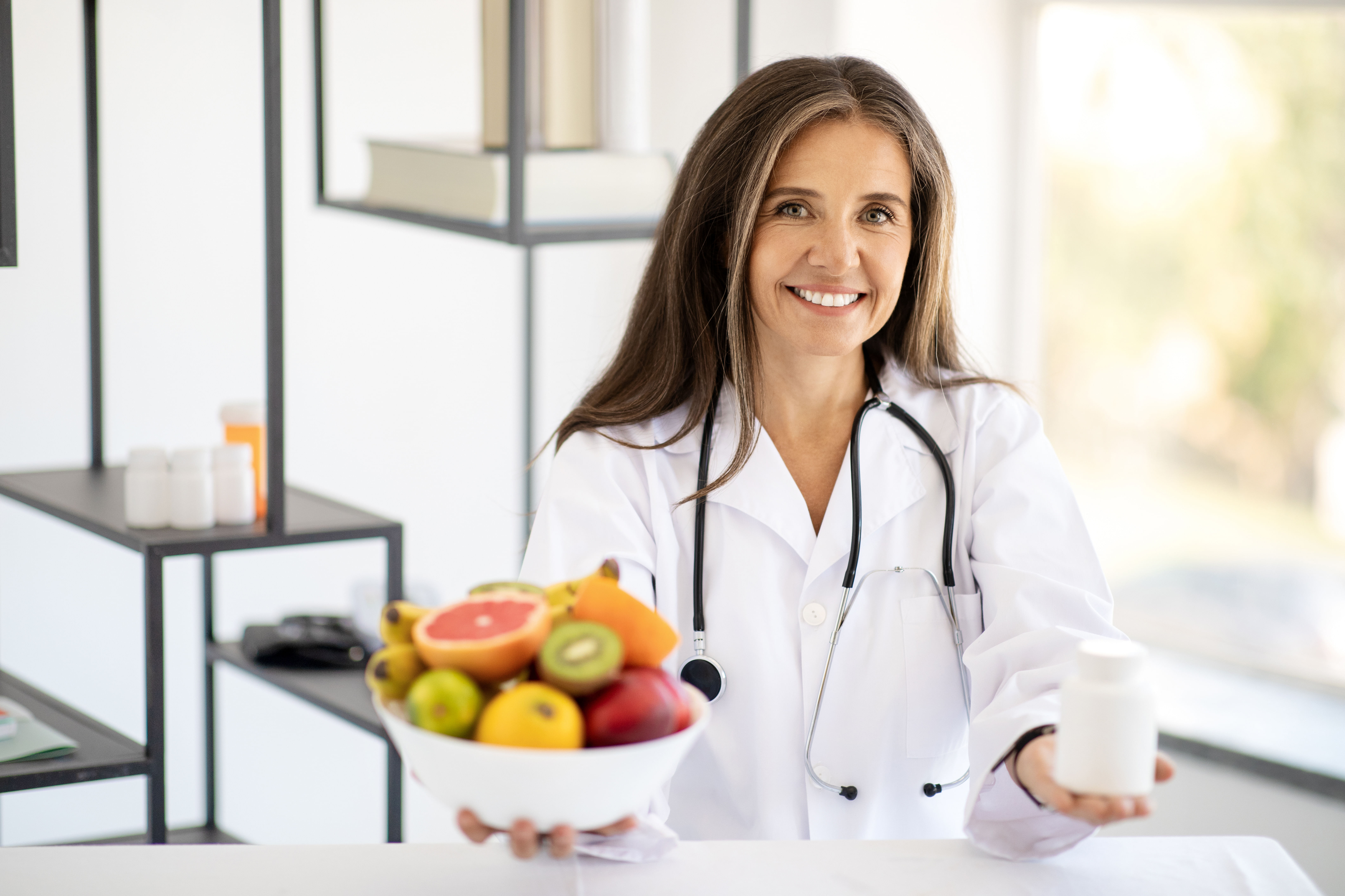 Dietitian offering bowl of fruit