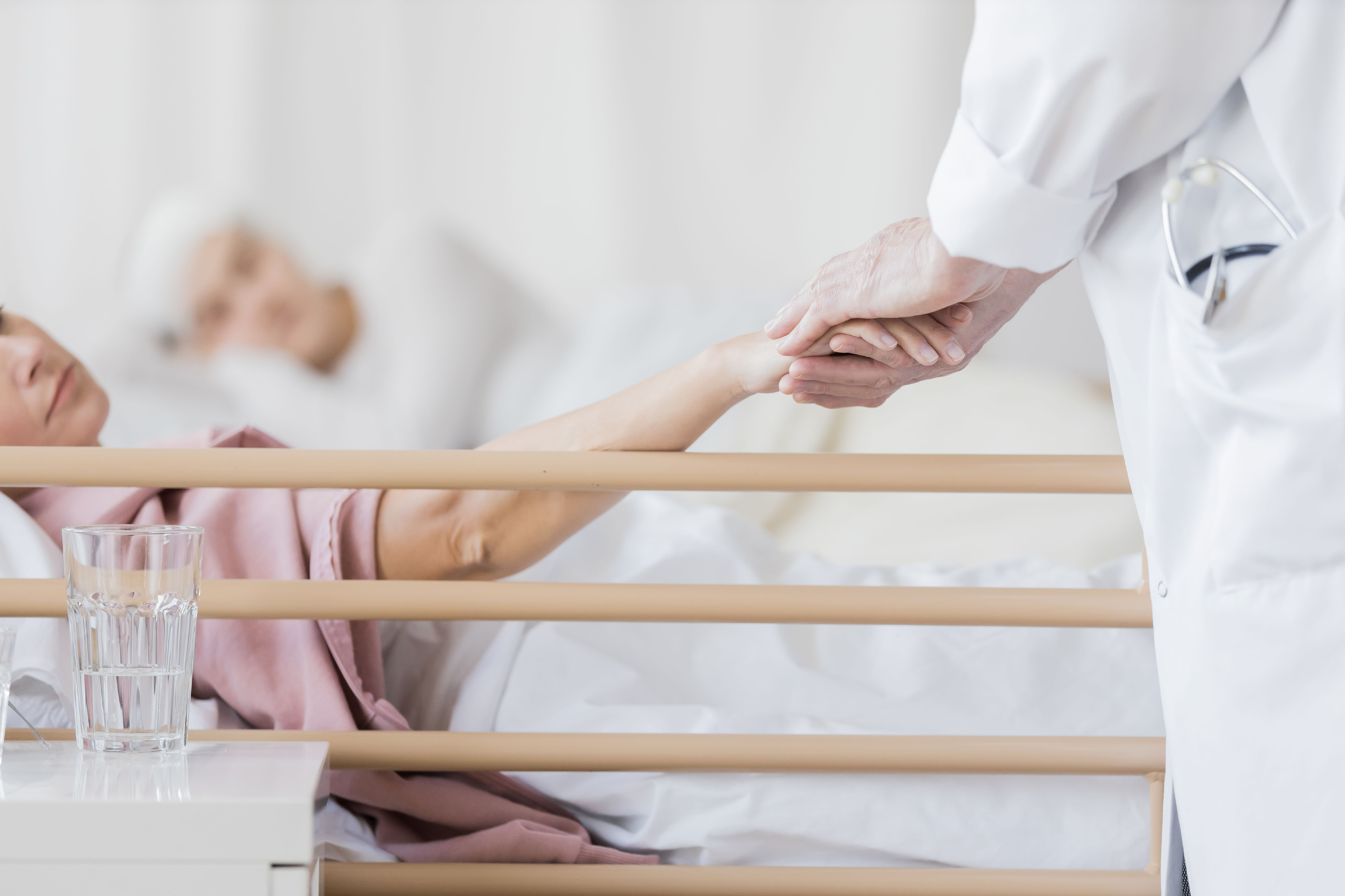 Smiling Elderly Lady looking at nurse