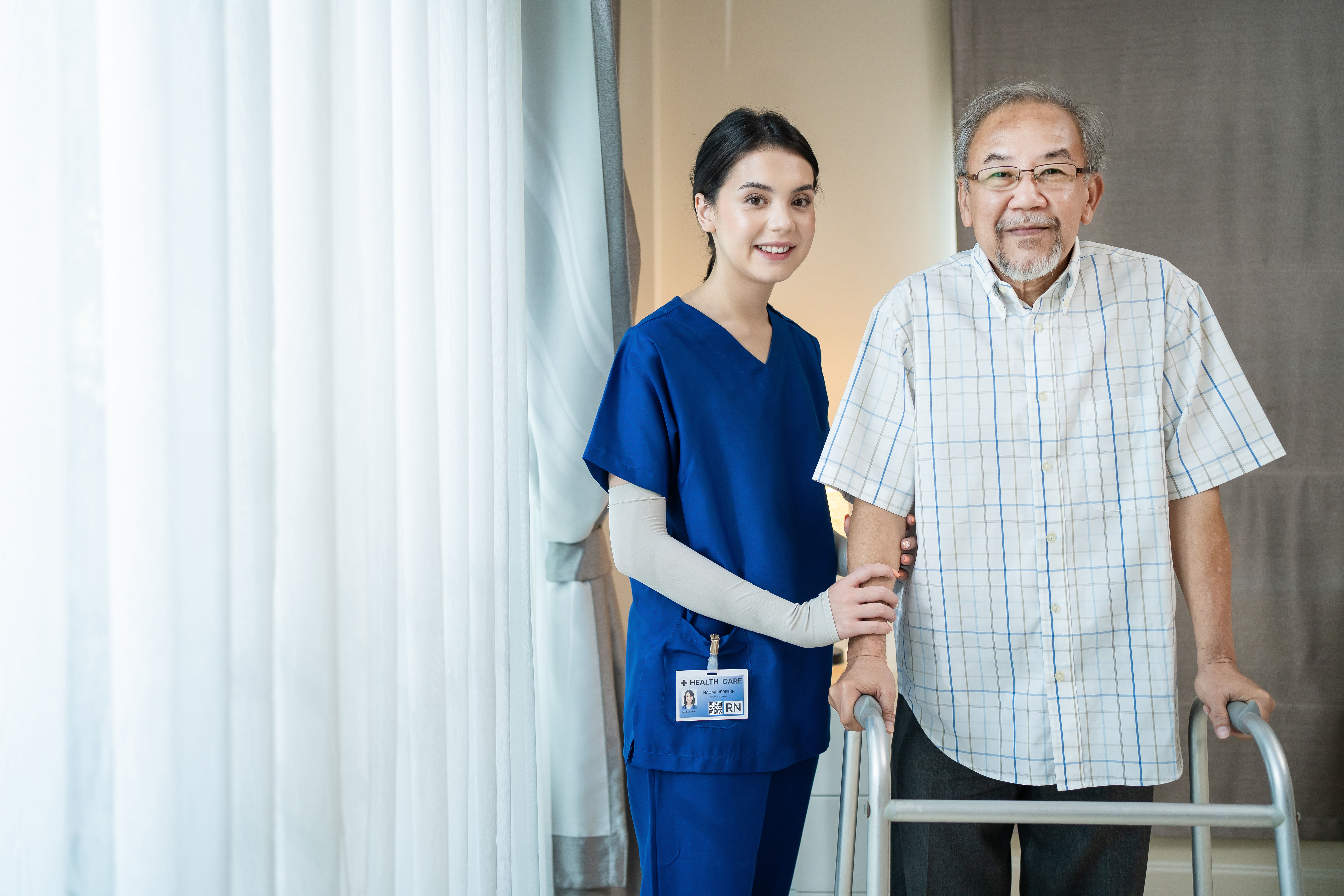 Portrait of asian disabled elderly and his caregiver