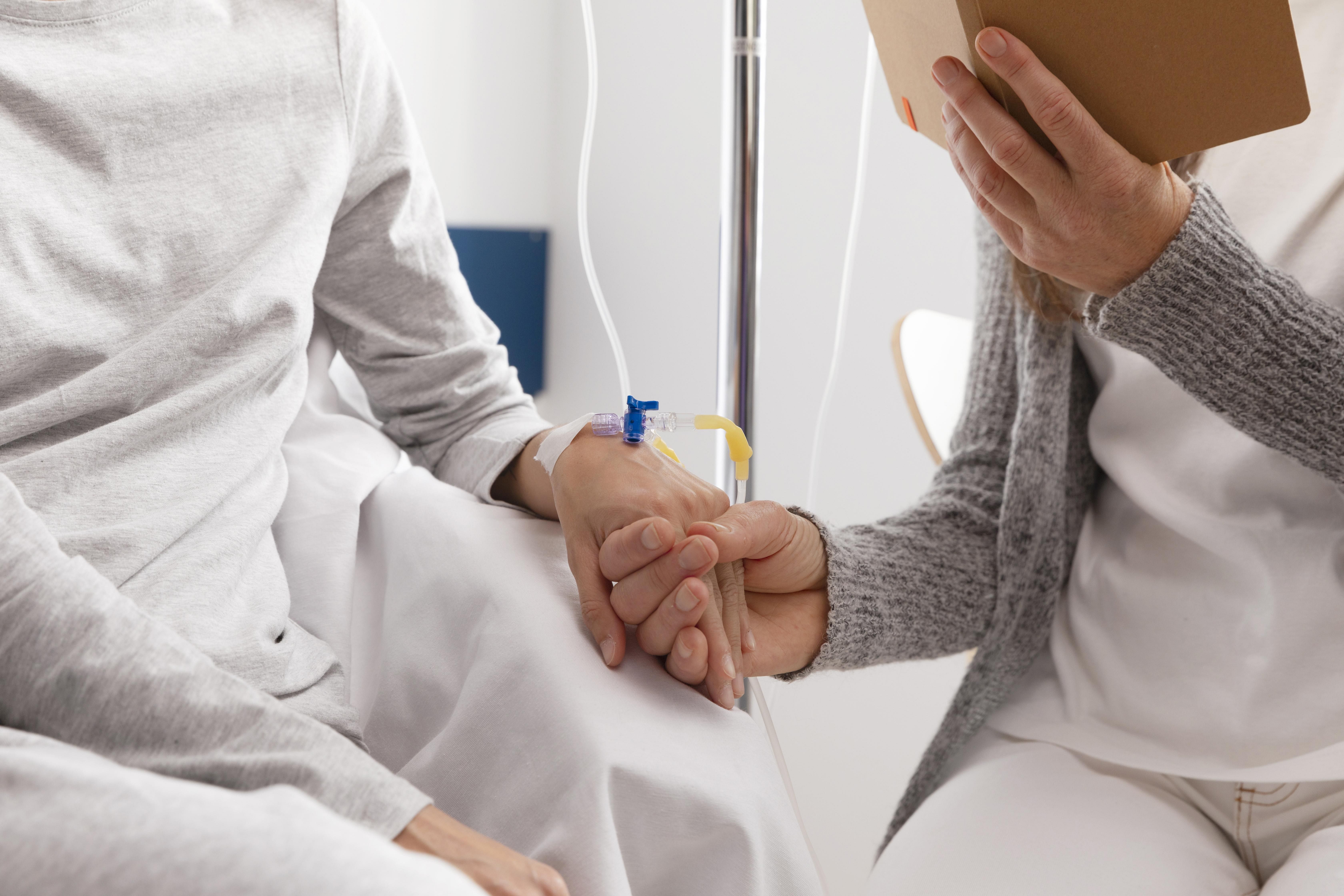 Male Nurse Speaking to Elderly man