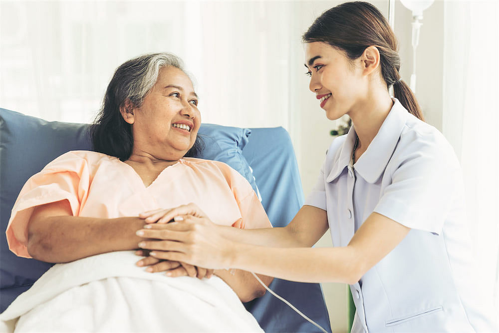 hospice nurse helping patient