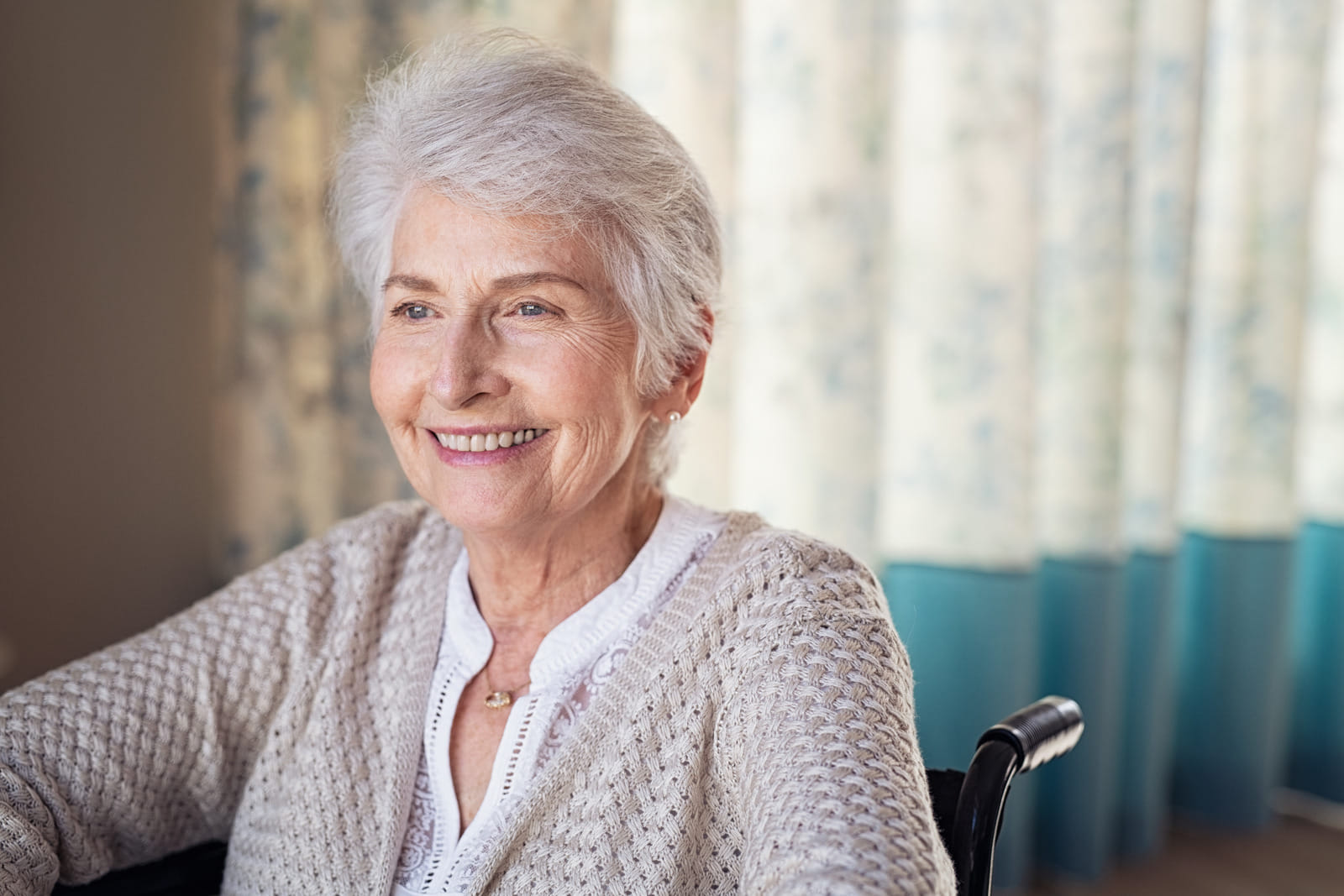 smiling senior woman in a wheelchair in Alamagordo, NM