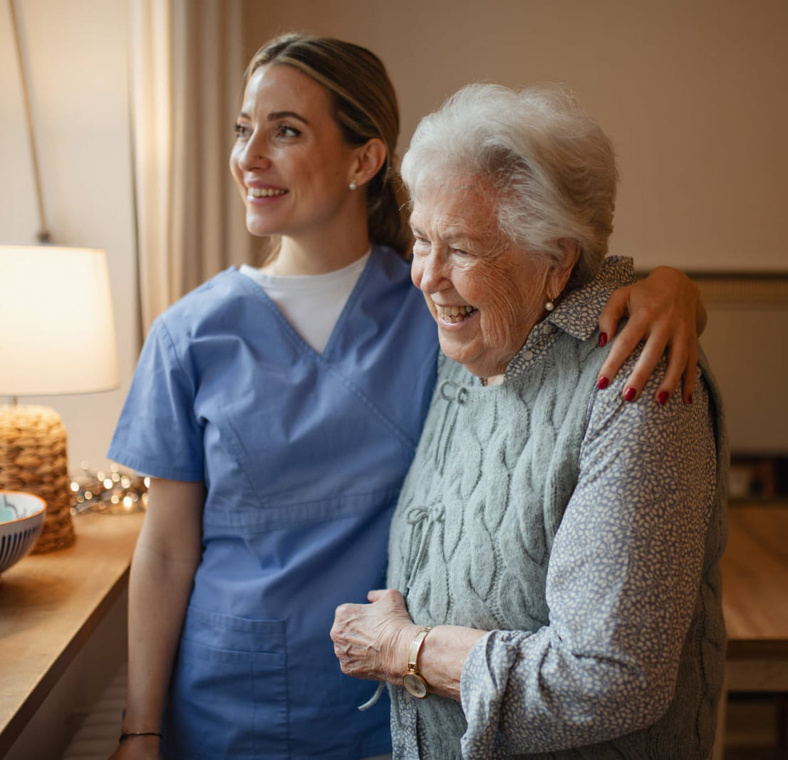 Hospice care worker speaking with patient in nursing home in Alamagordo