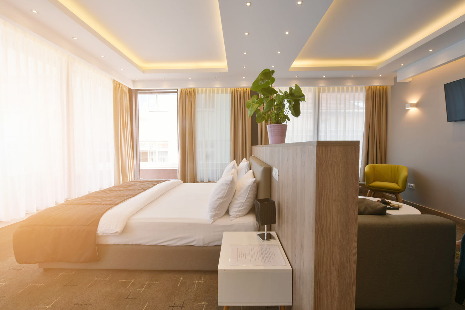 modern clean bright hotel bedroom with natural light